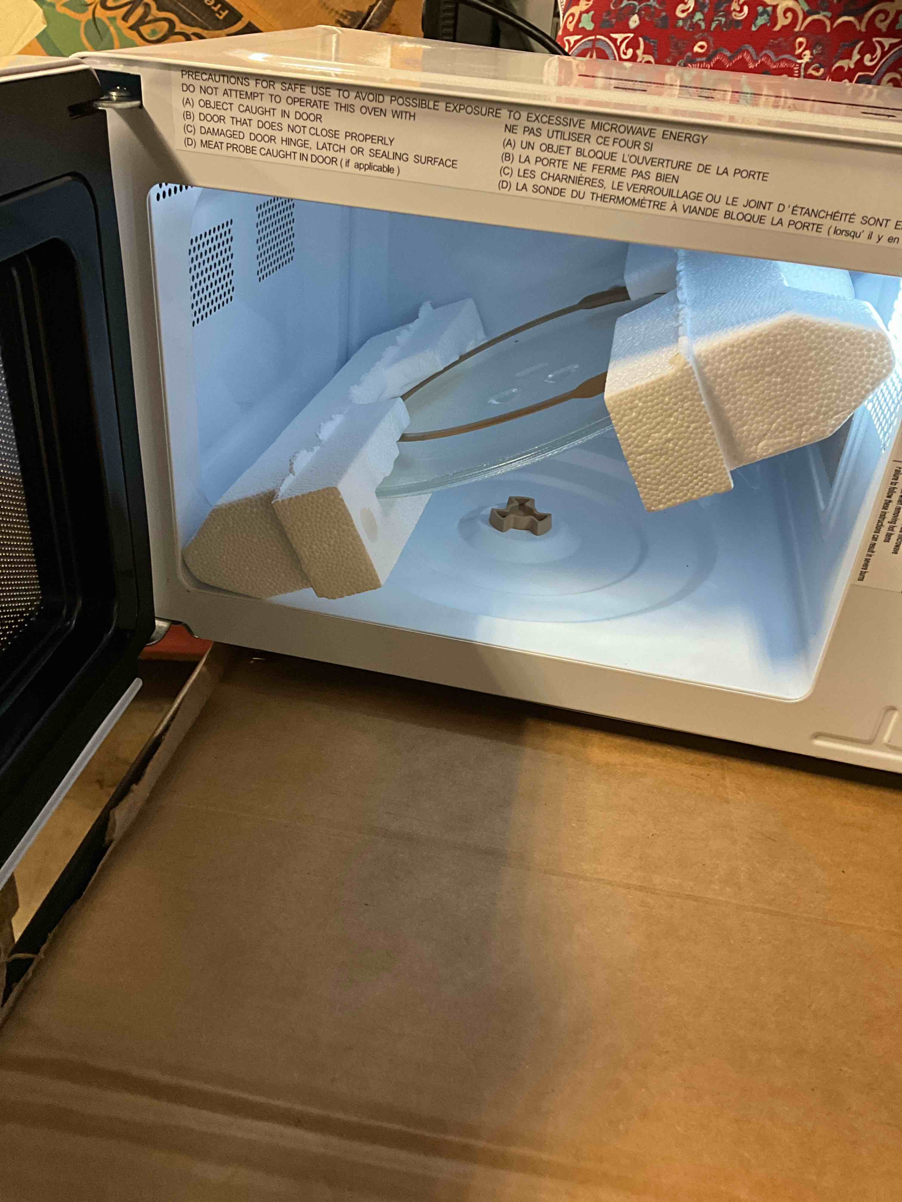 Condition photo showing New/Like New for 0.7 cu. ft. Electric 700-W Countertop Microwave in White with Turntable, 6-Heating Functions, and 2-Step Lock System