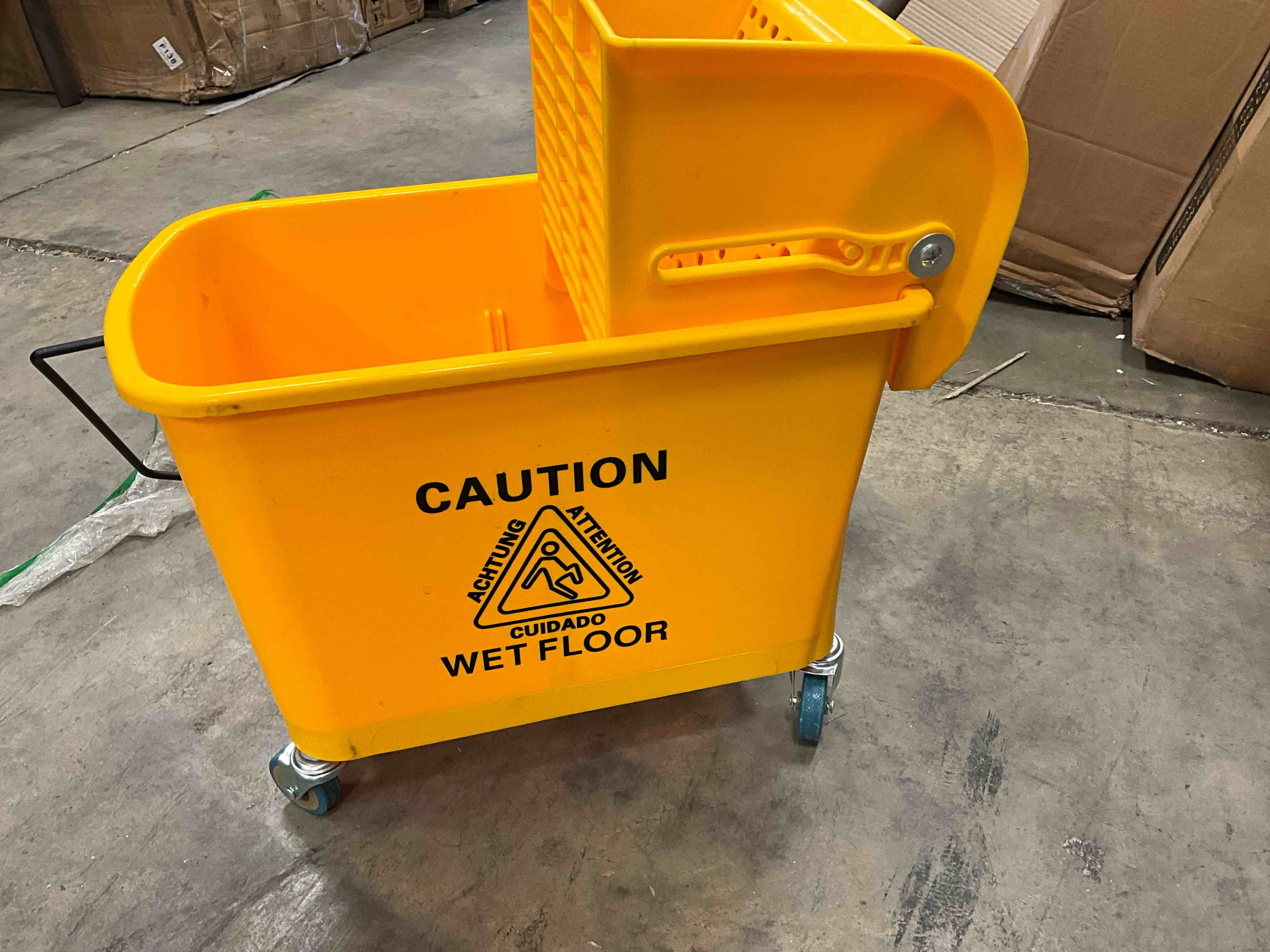 Condition photo showing Good Condition for missing water separator. 5 gal. yellow plastic cleaning bucket, janitor mop bucket with down press wringer and wheels