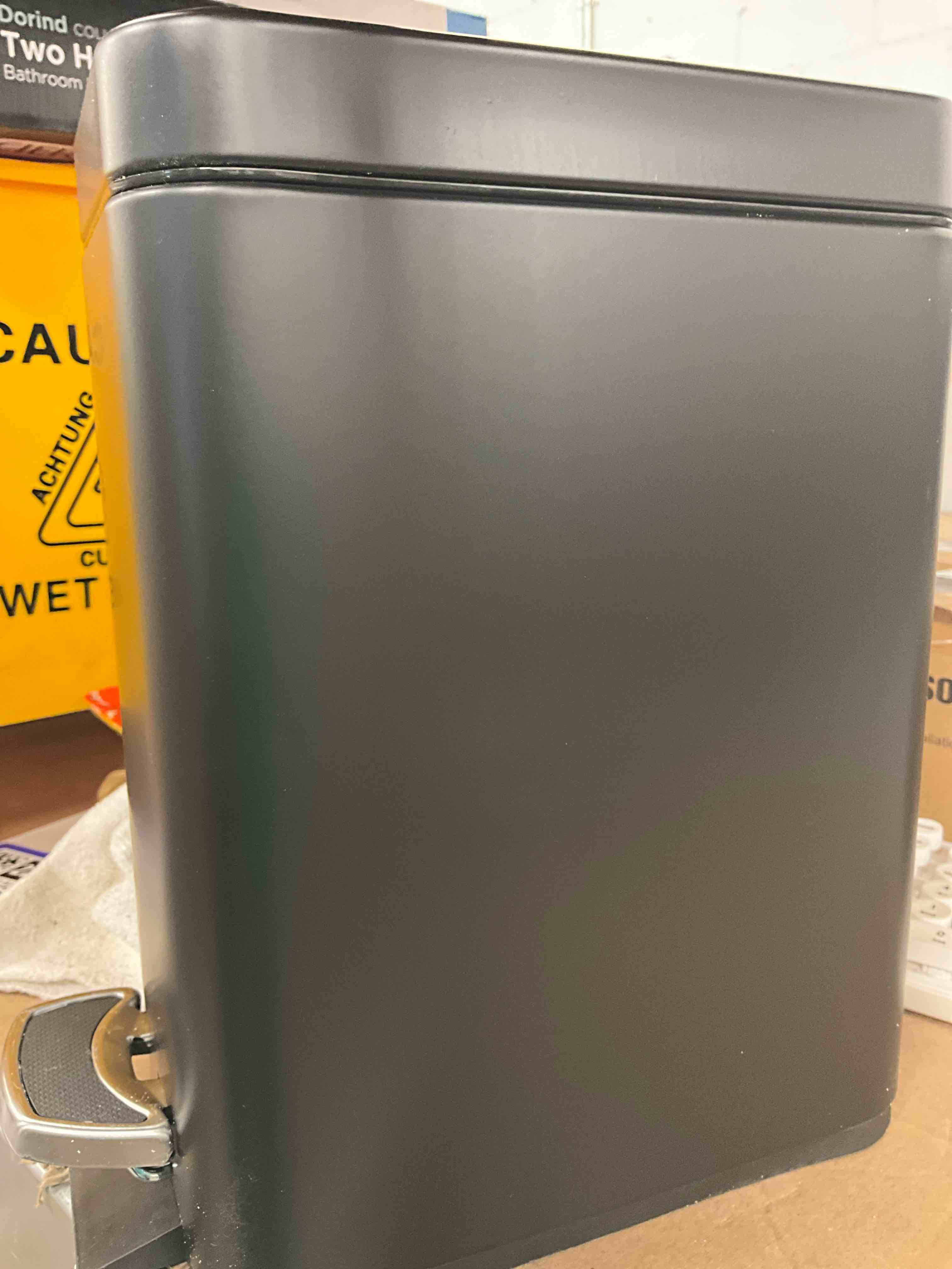 Condition photo showing New/Like New for home zone living 1.3 gallon bathroom trash can with a lid, stainless steel wastebasket with slim shape and step pedal for home and office, 5 liter capacity, matte black