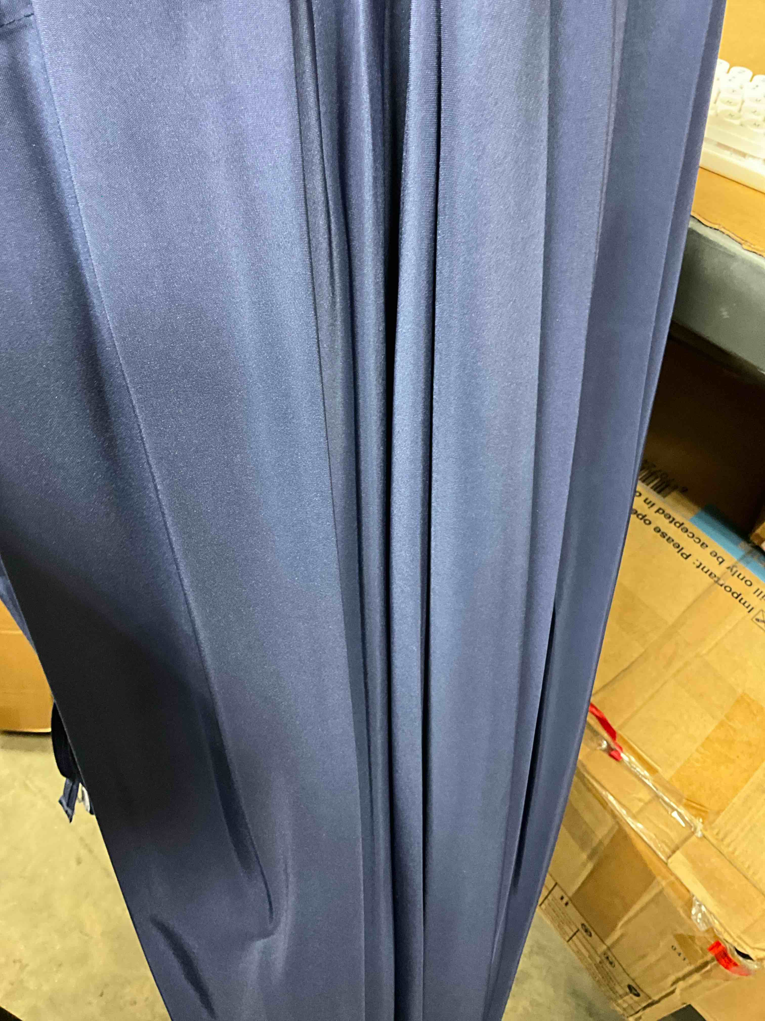 Condition photo showing New/Like New for 9 ft. round 8-rib steel market umbrella in navy