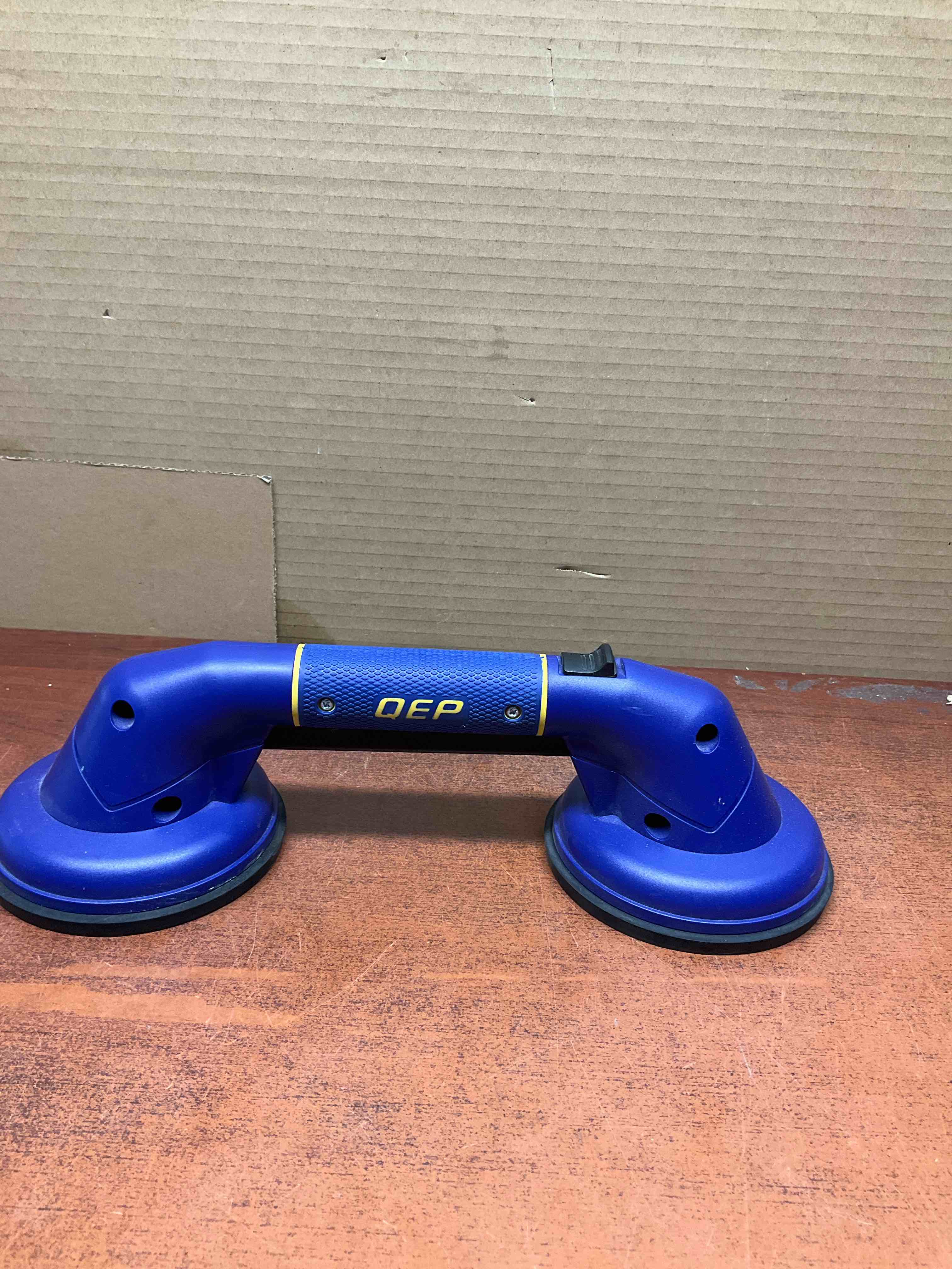 QEP pro max grip/ used for tile, glass or anything non porous 
