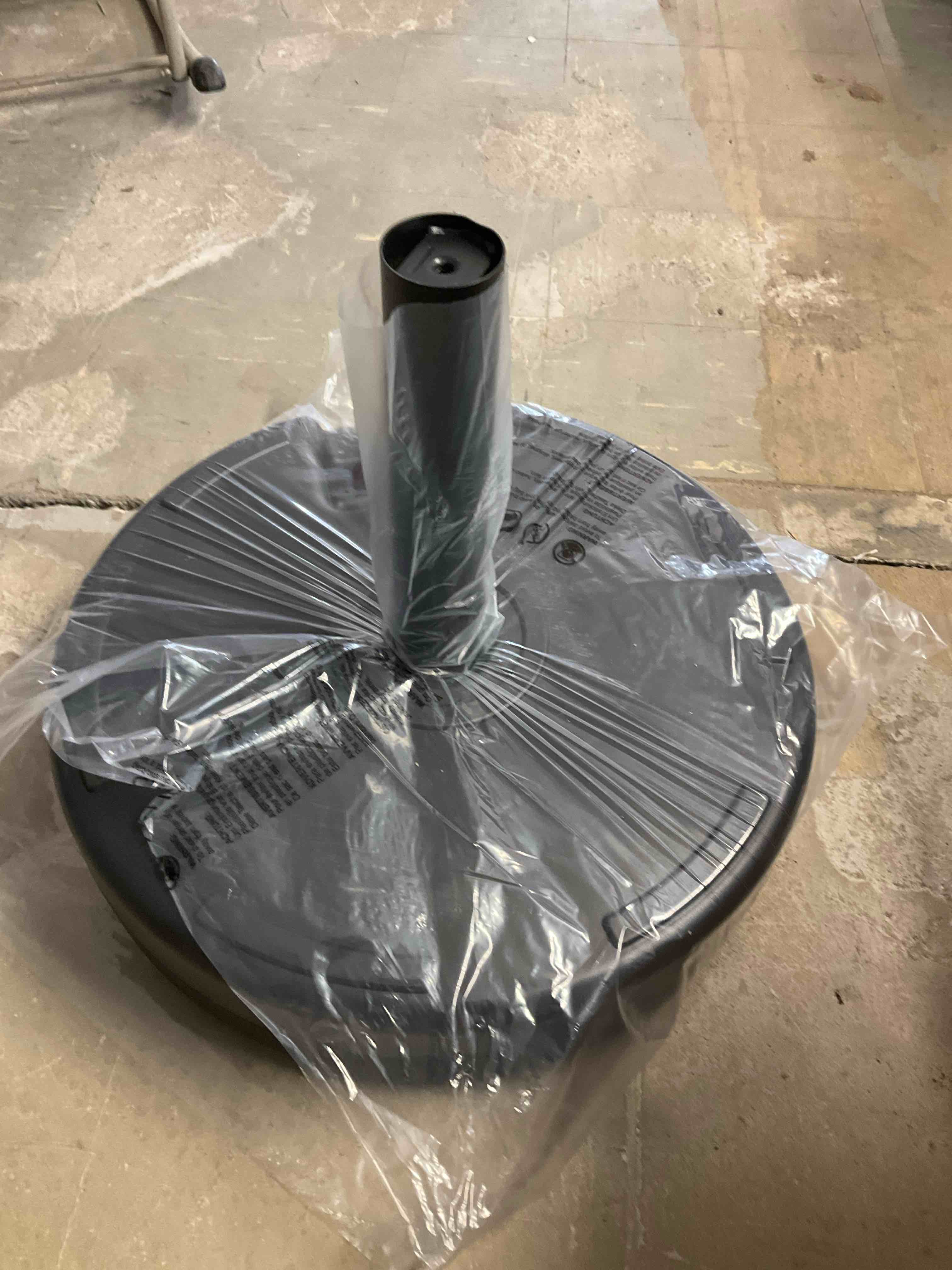 Umbrella base fill with water or sand