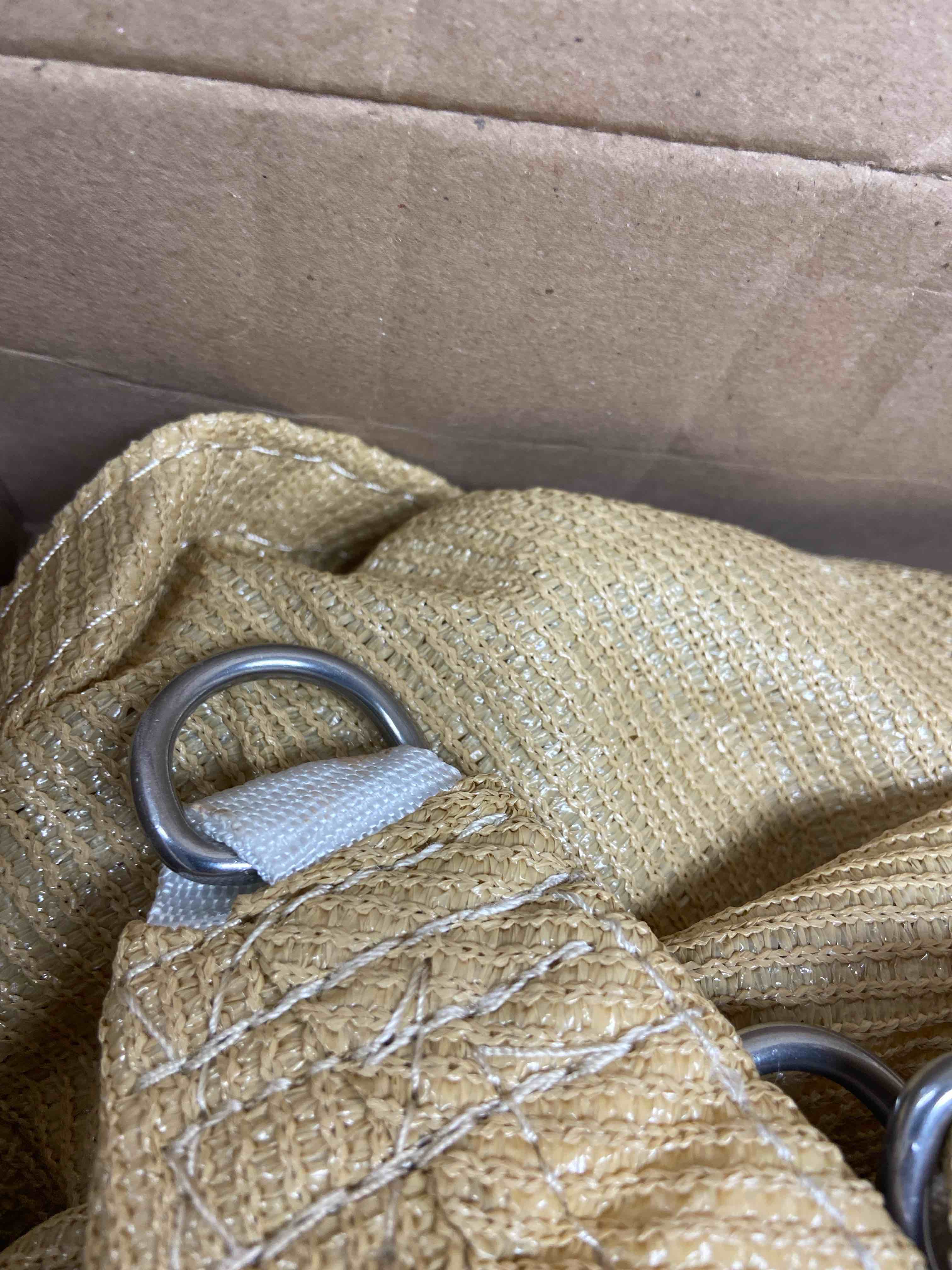 Condition photo showing New/Like New for 10’ triangle shade sail brown with metal hook up