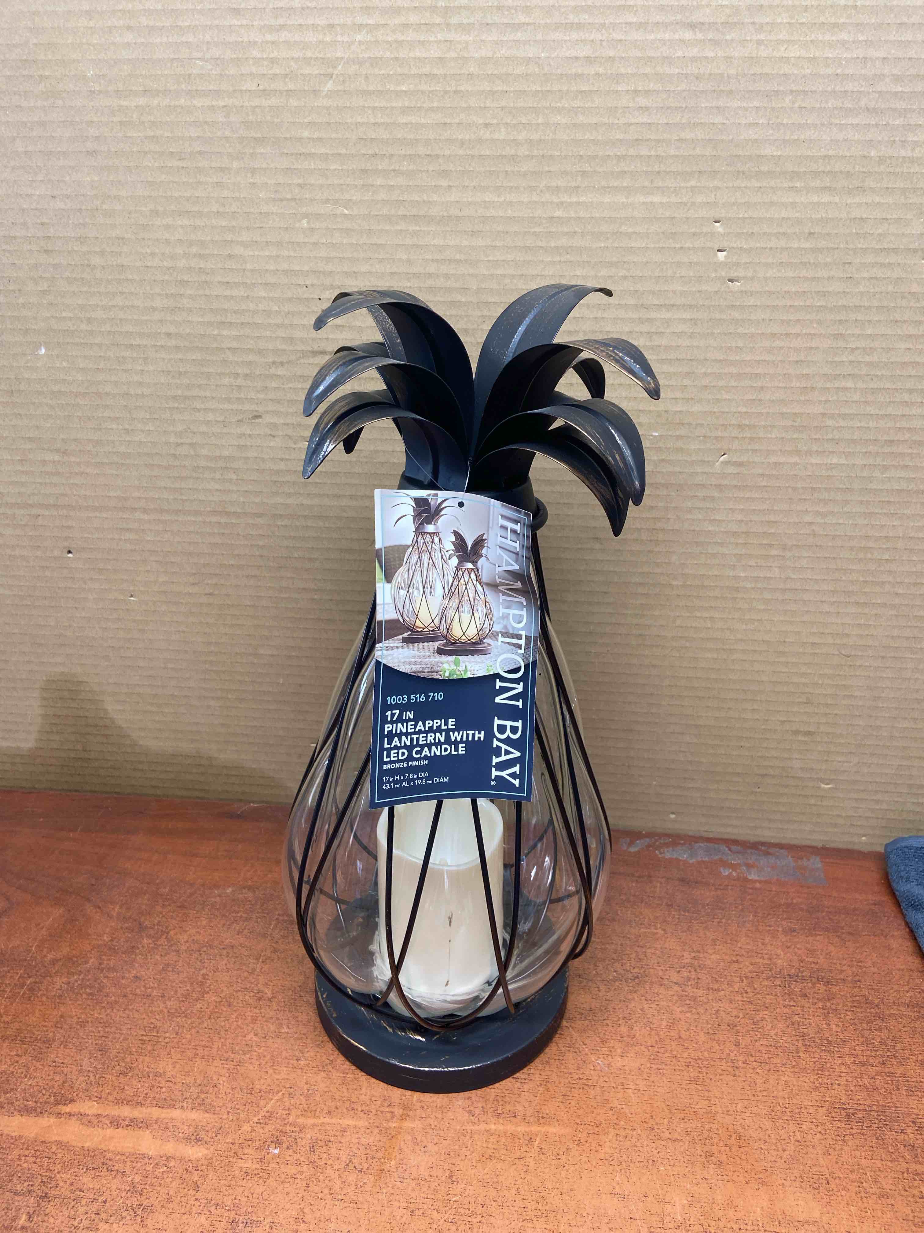Condition photo showing New/Like New for 17 in. aged bronze outdoor patio led candle pineapple lantern