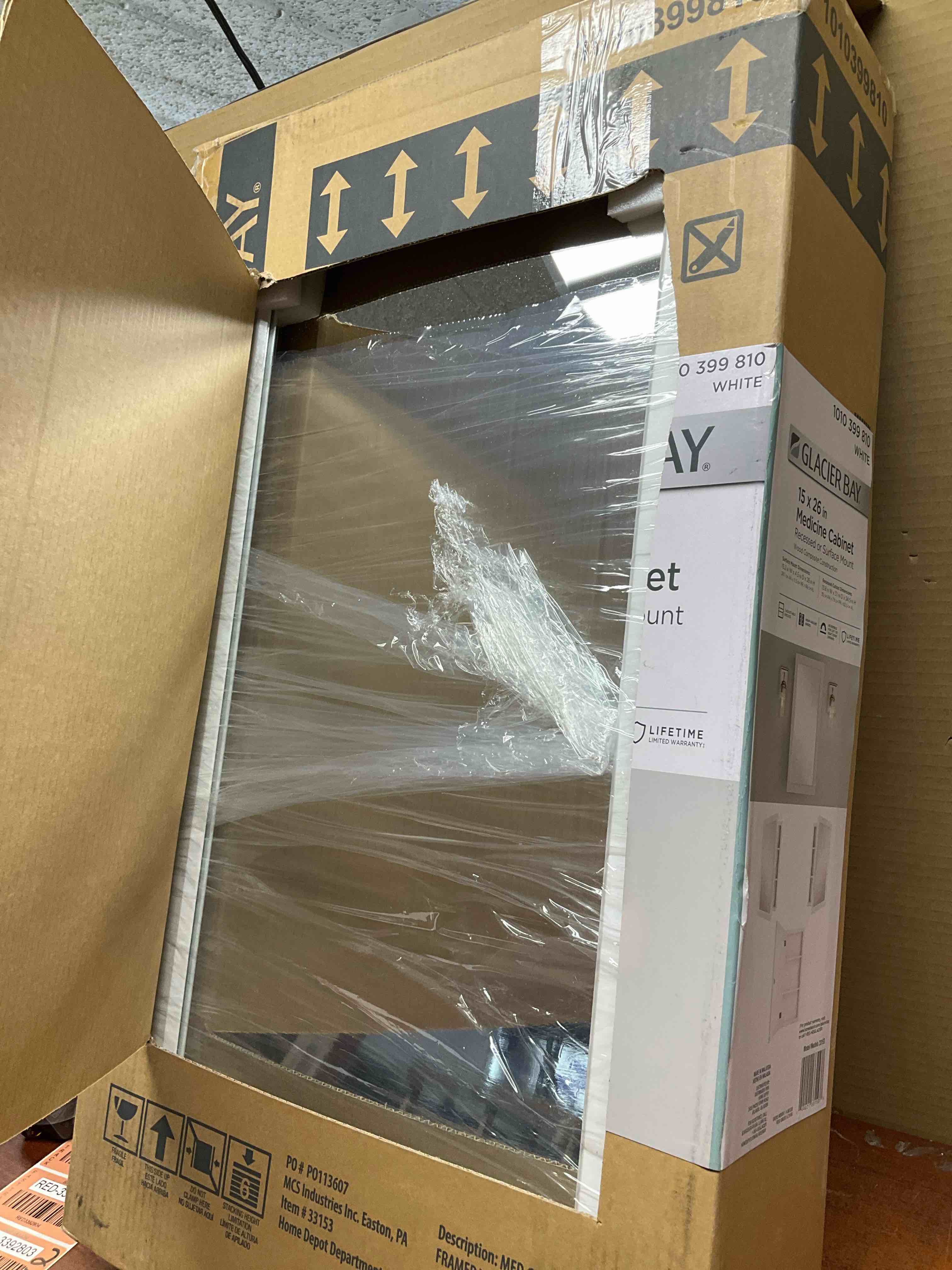 Condition photo showing New/Like New for 15-1/4 in. w x 26 in. h framed recessed or surface-mount bathroom medicine cabinet with mirror in white