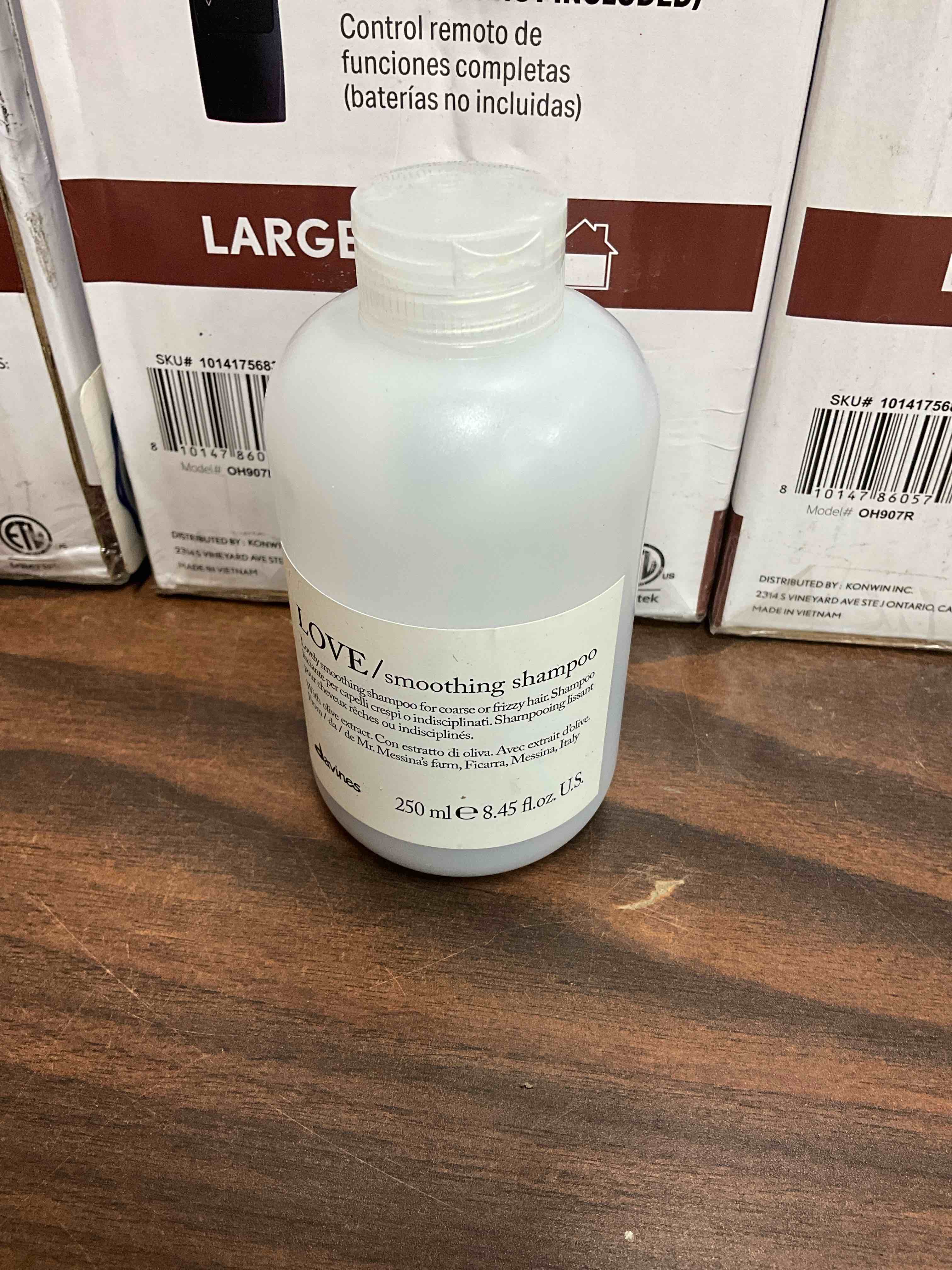 Condition photo showing Good Condition for half full. davines love smoothing shampoo, taming anti-frizz gentle cleansing action for wavy, unruly, coarse hair - gives shine, elasticity, softness, and a sleek smooth look with olive extract, 8.45 fl oz