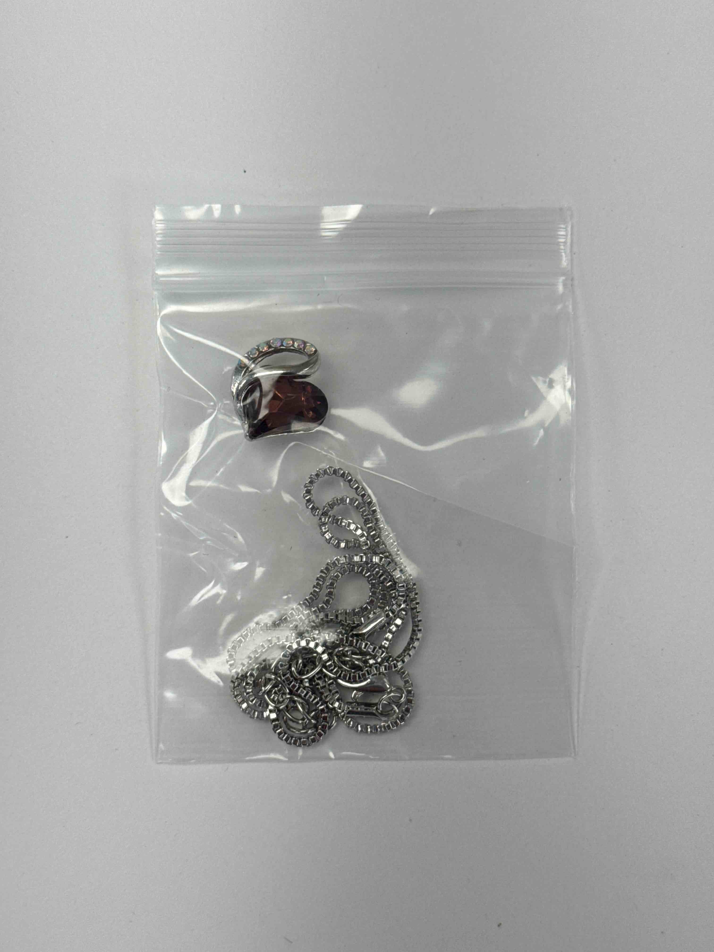 https://s3.amazonaws.com/lotting-images-prod/necklacebrown_1776779185212.jpeg