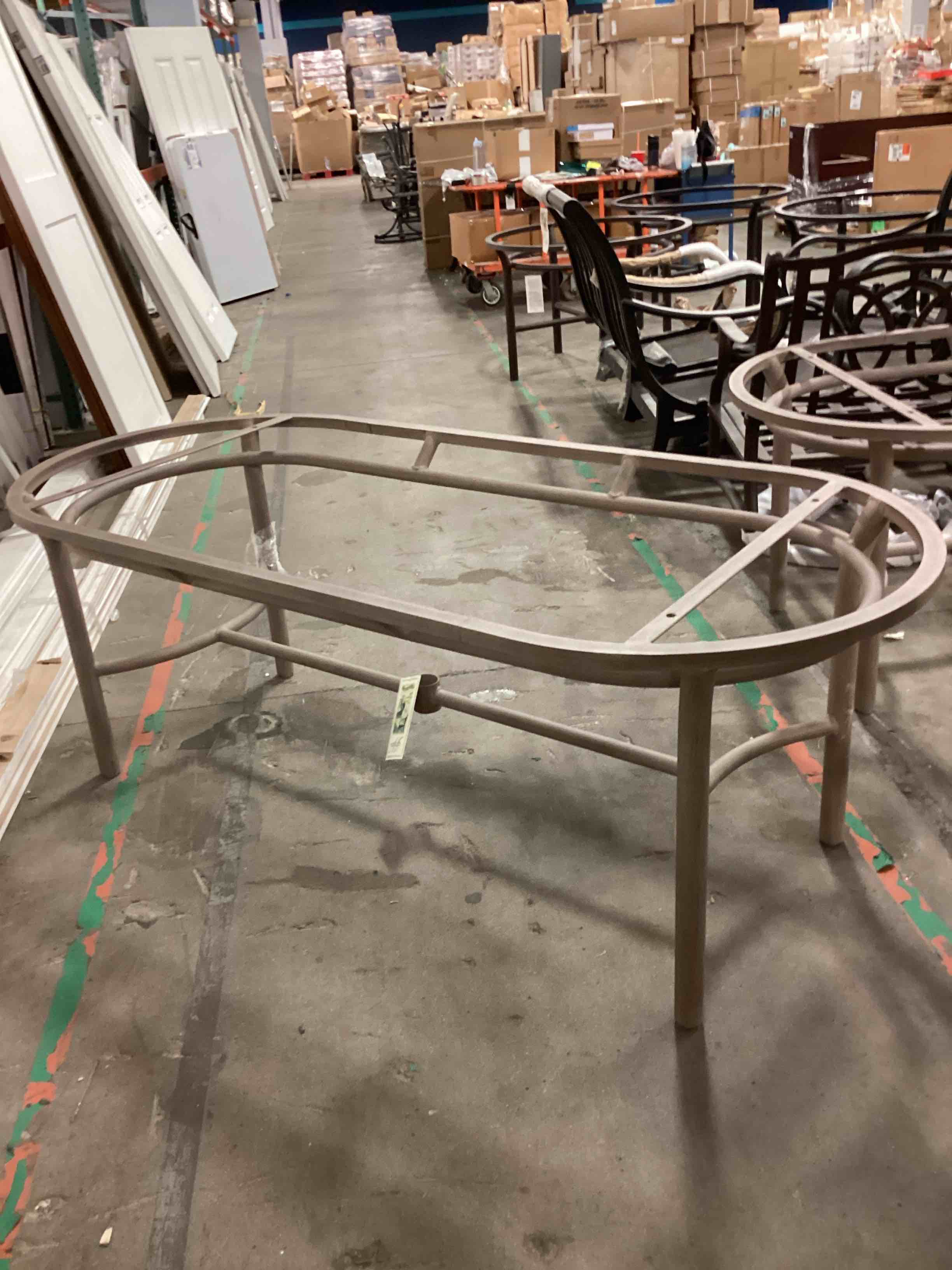 https://s3.amazonaws.com/lotting-images-prod/ovalmetaltablebeige_1752257149663.jpeg