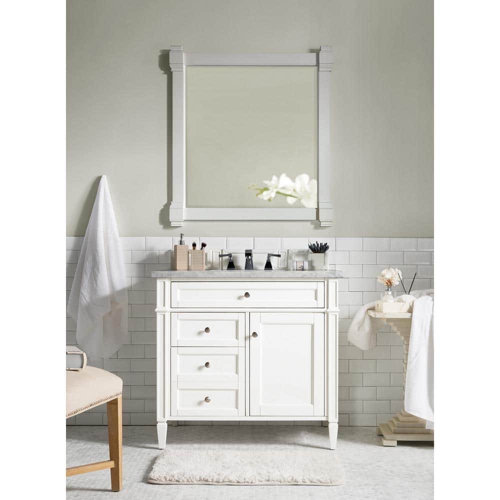 Brittany 36.0 in. W x 23.5 in. D x 34 in. H Single Bath Vanity in Bright White with Carrara Marble Top. 4 Drawer, One Cabinet Vanity in White with Pewter Knobs, and Single Sink Carrara Marble Top. Has 2 Boxes, Top and Vanity
