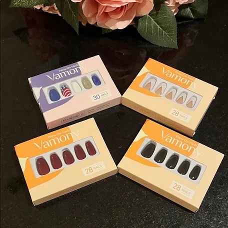 Condition photo showing New/Like New for lot of 4 vamony press on nails 