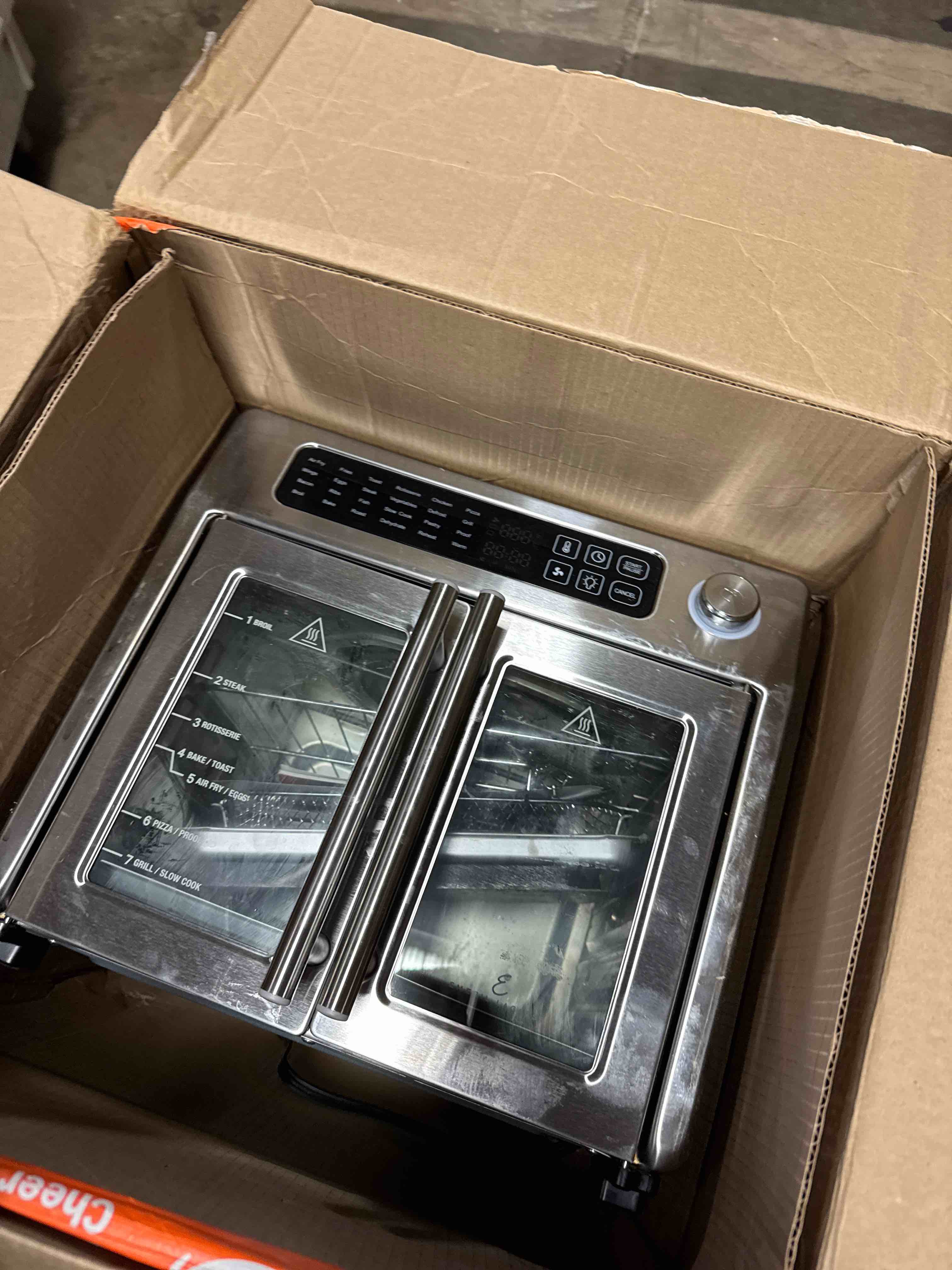 Condition photo showing Good Condition for Emeril Lagasse Extra Large French Door Air Fryer Toaster Oven Combo, 24 Cooking Functions and Digital Controls, 7 Accessories Included, Stainless Steel Finish, 26QT Capacity ( Used)