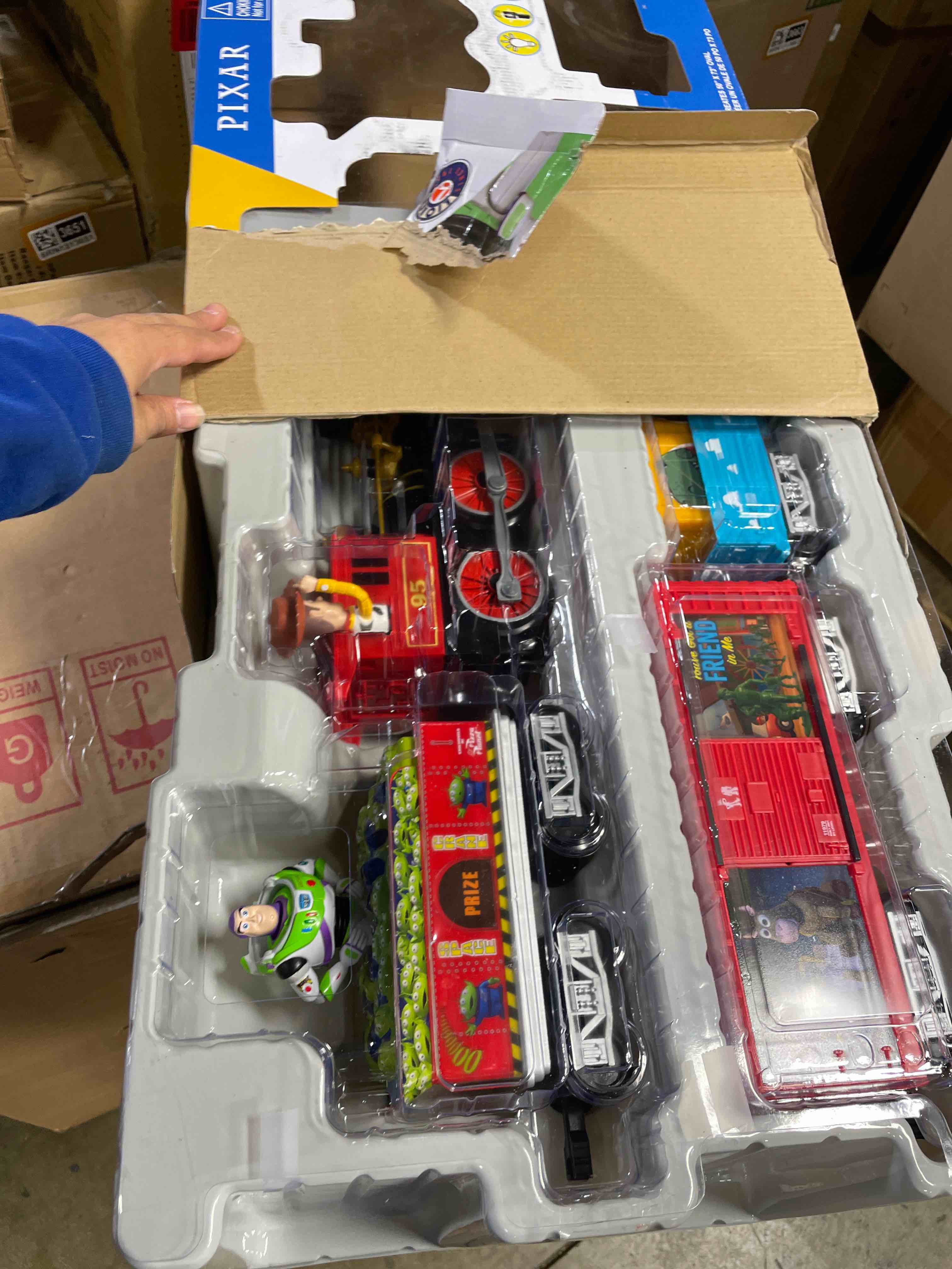 Condition photo showing New/Like New for Lionel Battery-Operated Disney Toy Story Toy Train Set with Locomotive, Train Cars, Track & Remote with Authentic Train Sounds, & Lights for Kids 4+ Ready-to-Play