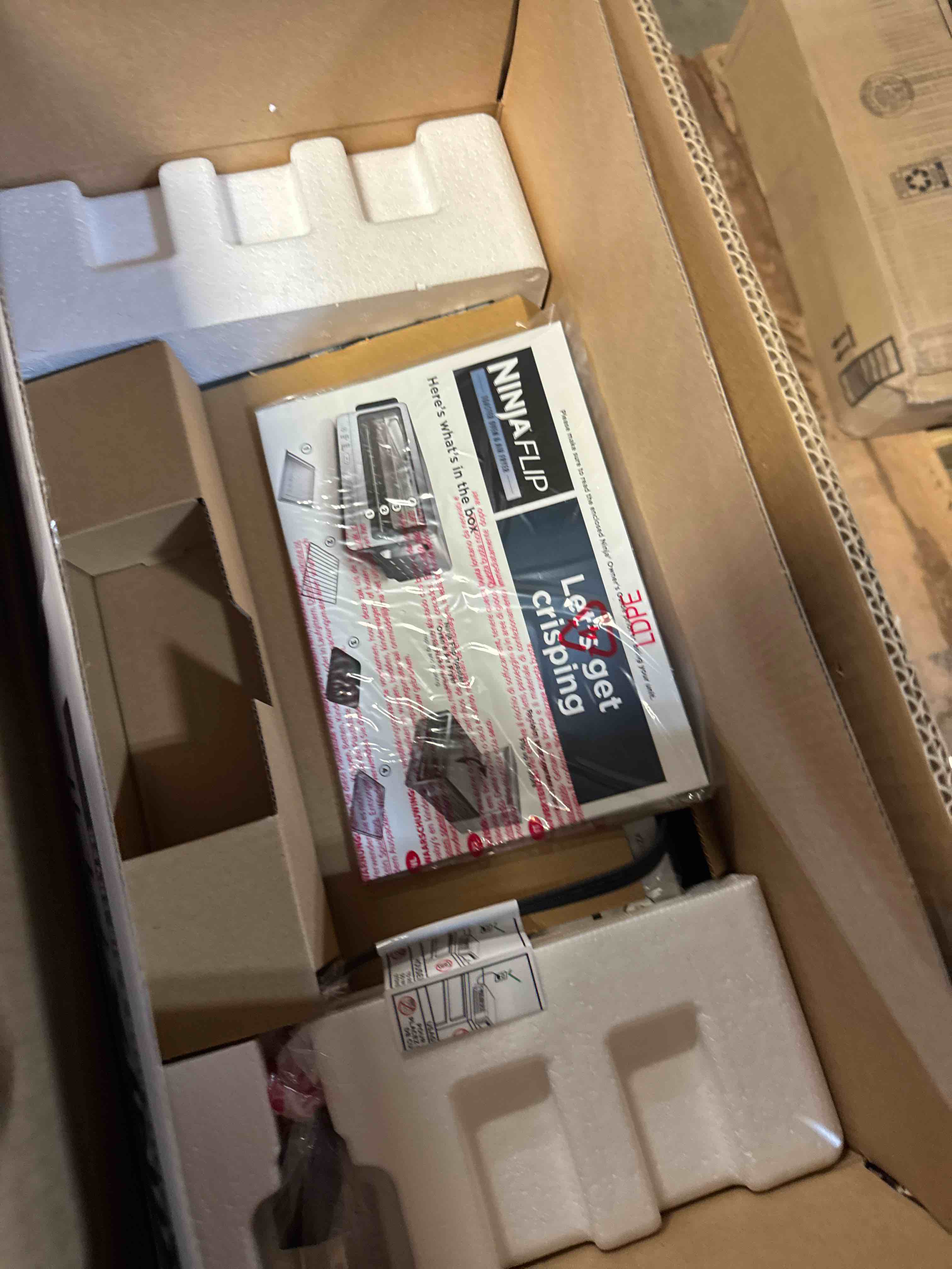 Condition photo showing New/Like New for Ninja Air Fryer Toaster Oven Combo | 8-in-1 Functionality | Flip Up & Away for Storage Space | Air Fry Basket, Sheet Pan, Wire Rack & Removable Crumb Tray |1800 Watt | Stainless Steel | SP151 Stainless Premium 8-in-1 Flip Oven