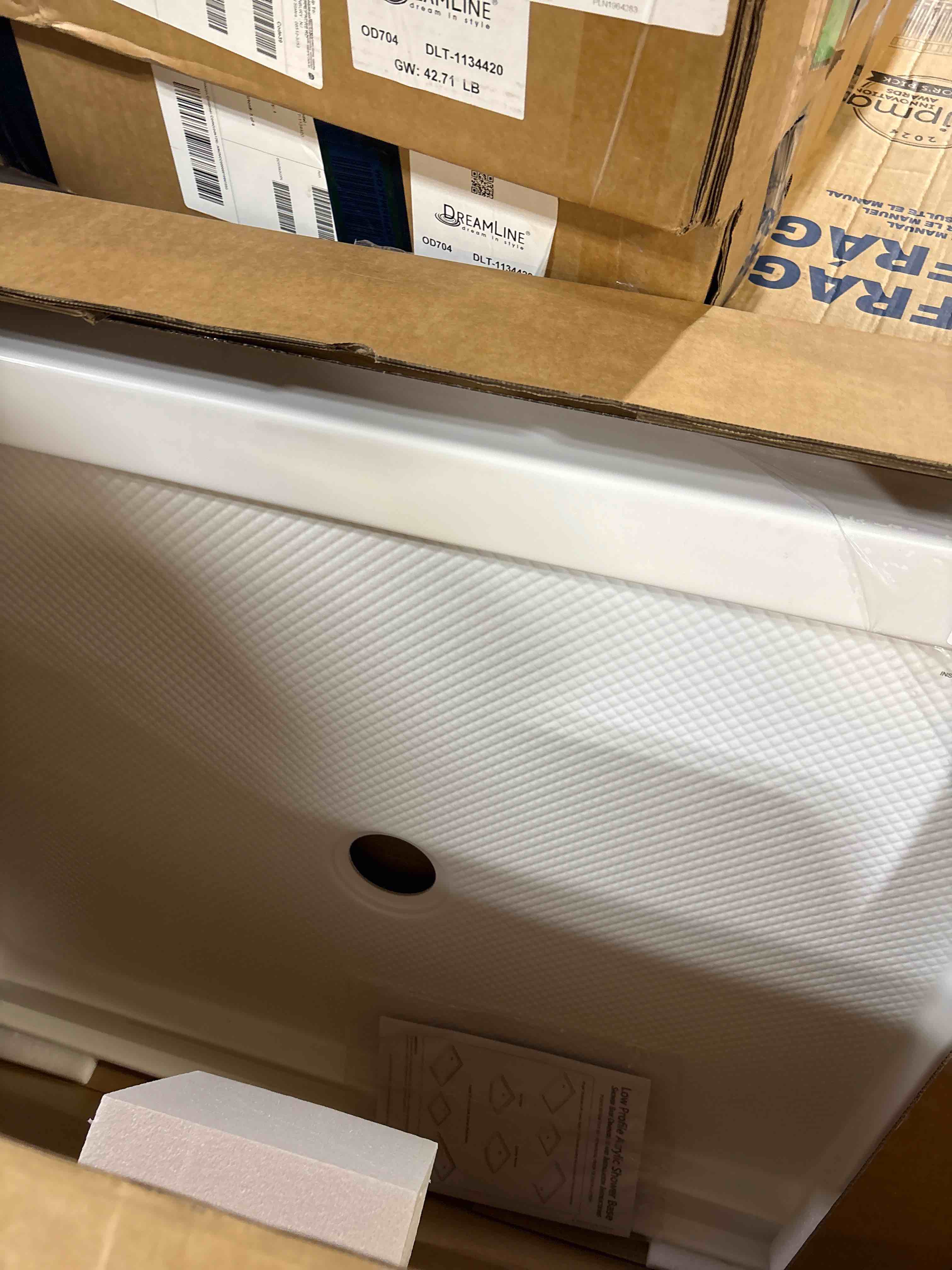 Condition photo showing New/Like New for DreamLine SlimLine 34 in. D x 42 in. W x 2 3/4 in. H Center Drain Single Threshold Shower Base in White, DLT-1134420