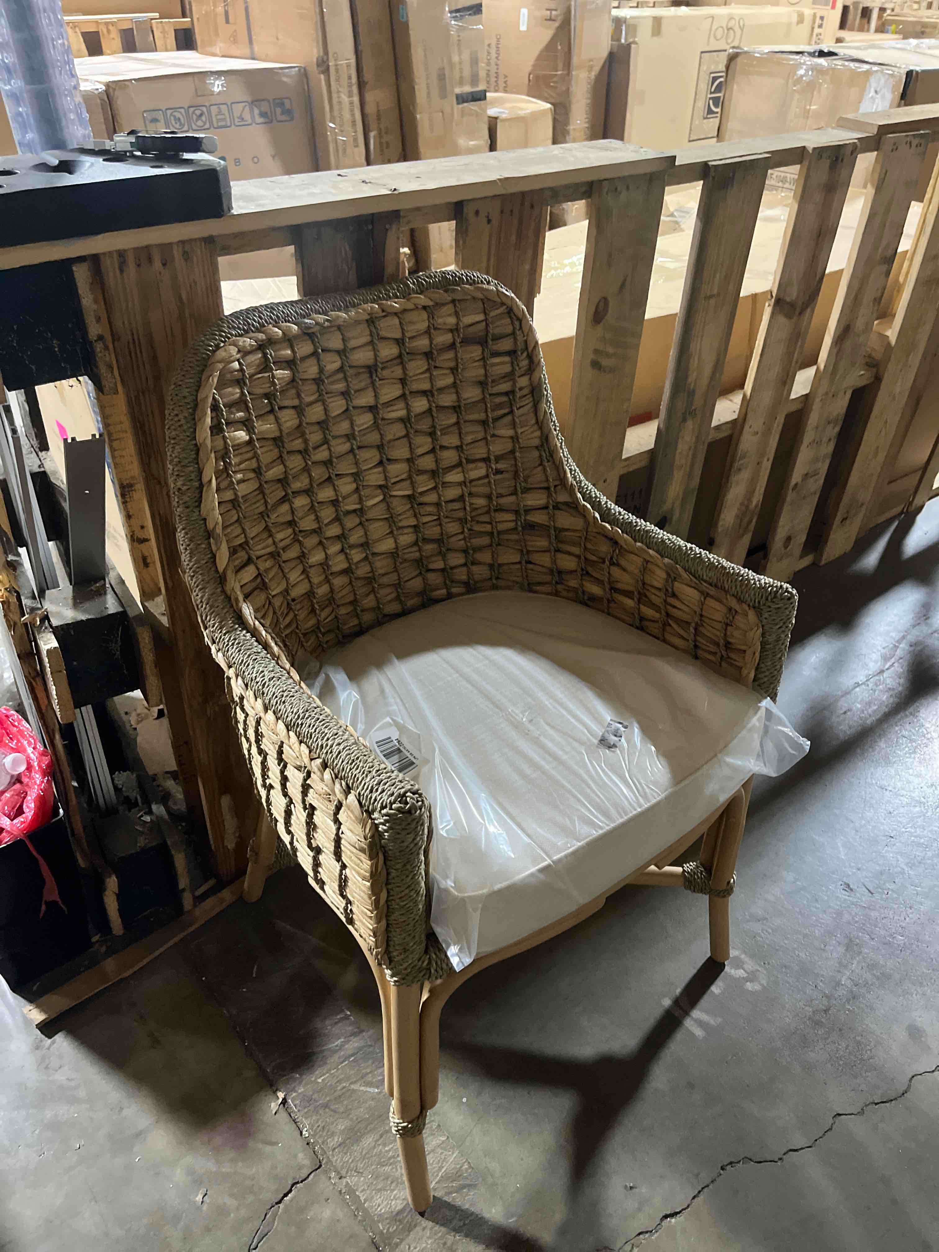 Condition photo showing New/Like New for Baxton Studio Kyle Modern Bohemian Natural Brown Woven Rattan Dining Arm Chair with Cushion