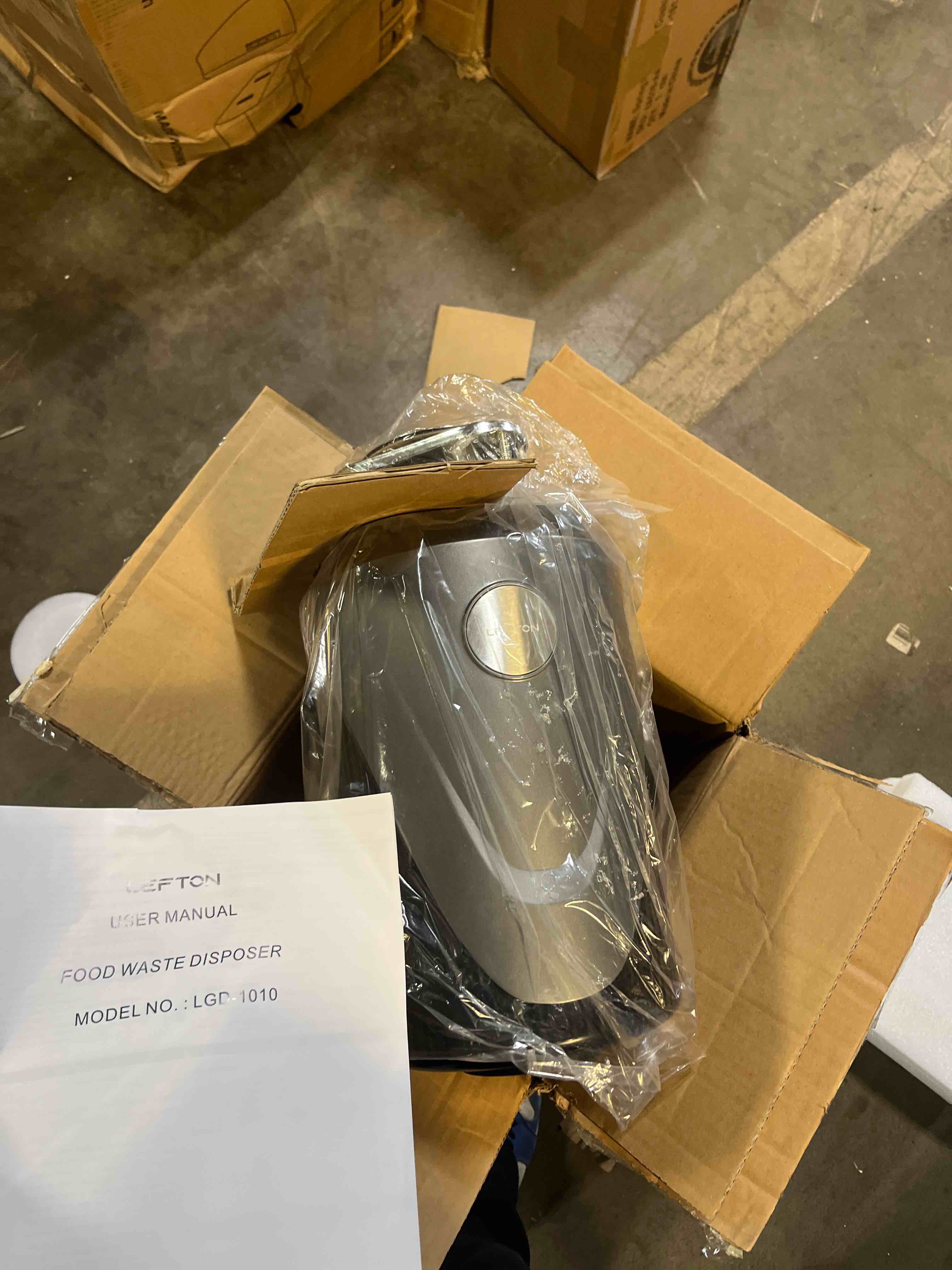 Condition photo showing New/Like New for lefton garbage disposal with power cord, 1 hp continuous feed food waste disposer, lgd-1010