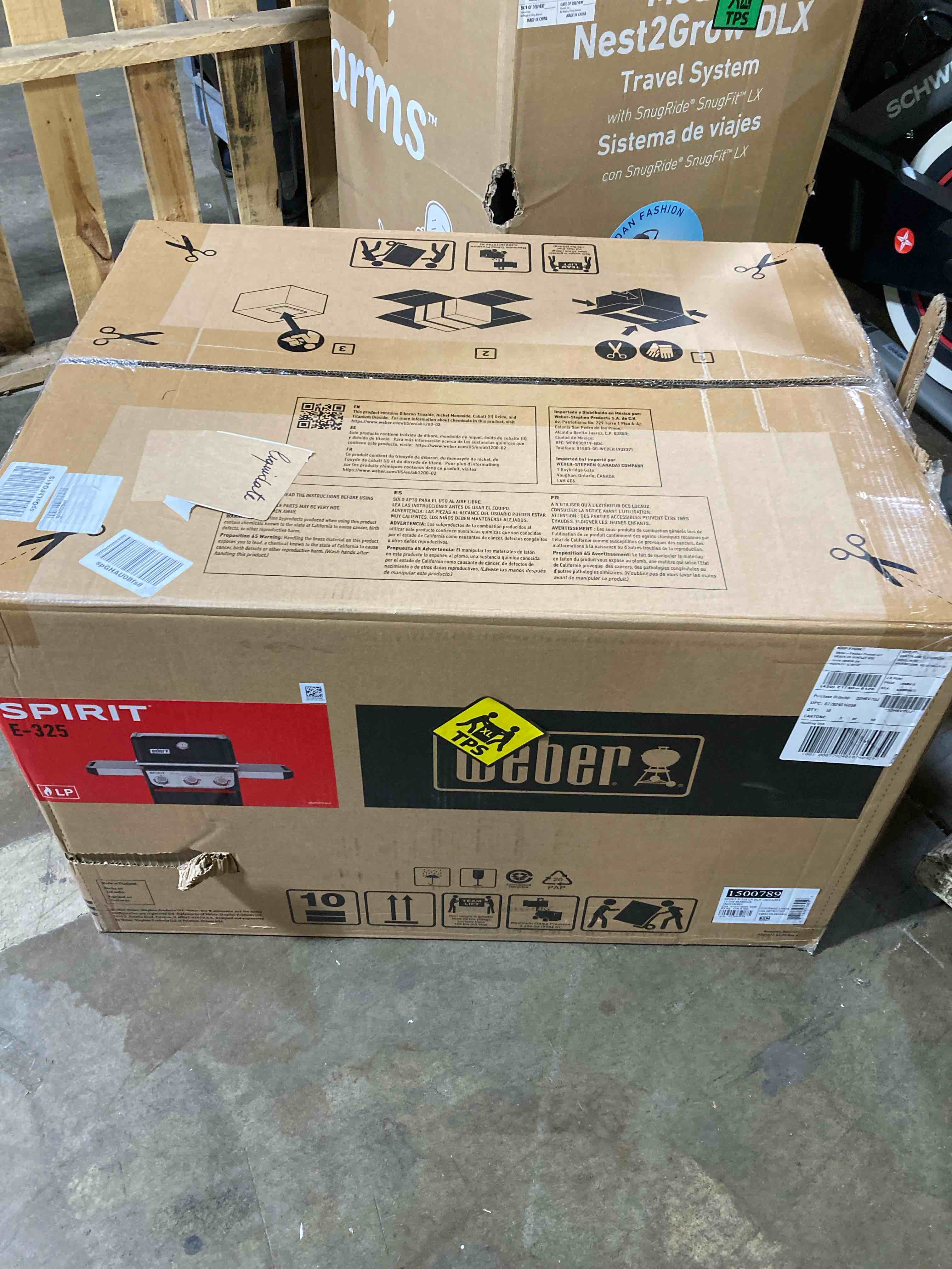 Condition photo showing New/Like New for spirit e-325 3-burner propane gas grill in black with powerful boost burners