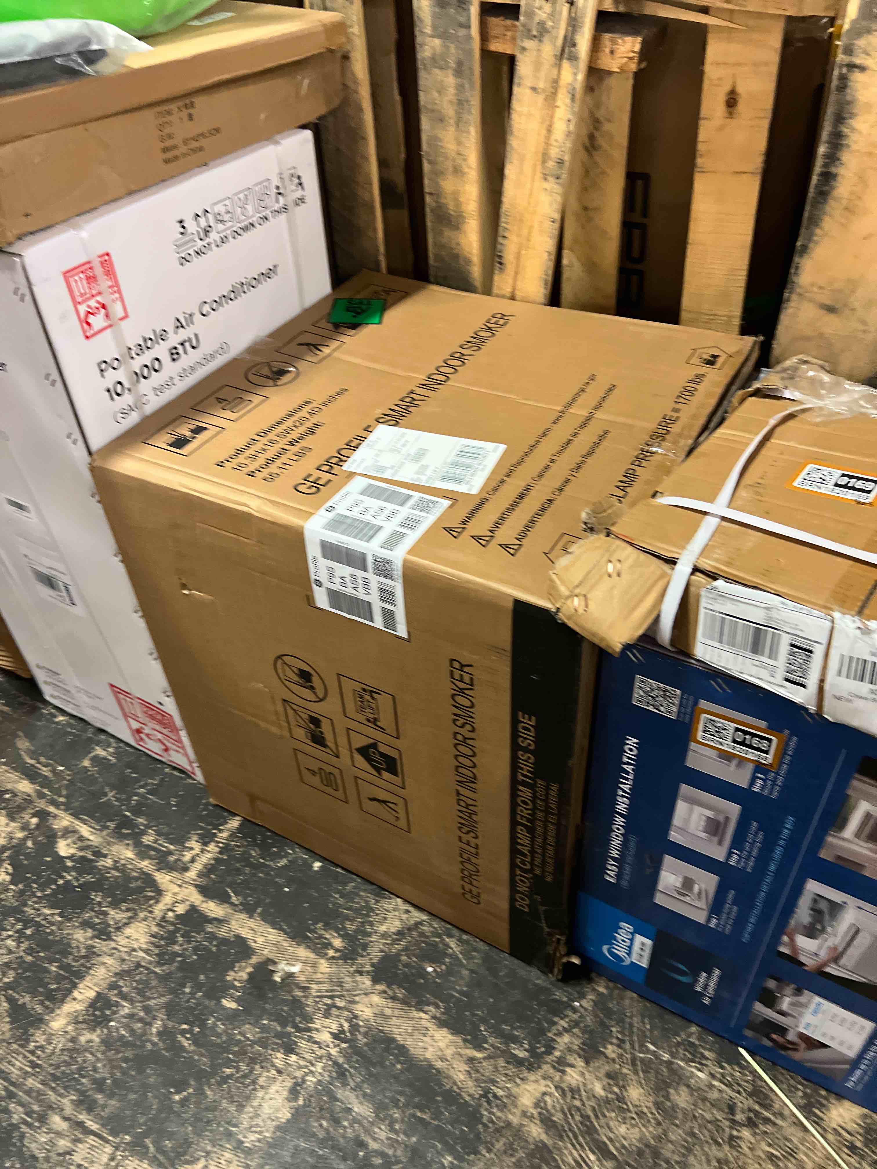 Condition photo showing New/Like New for ge profile smart indoor pellet smoker, with active smoke filtration, 5 smoke control settings, wifi connected, electric, countertop bbq appliance, black