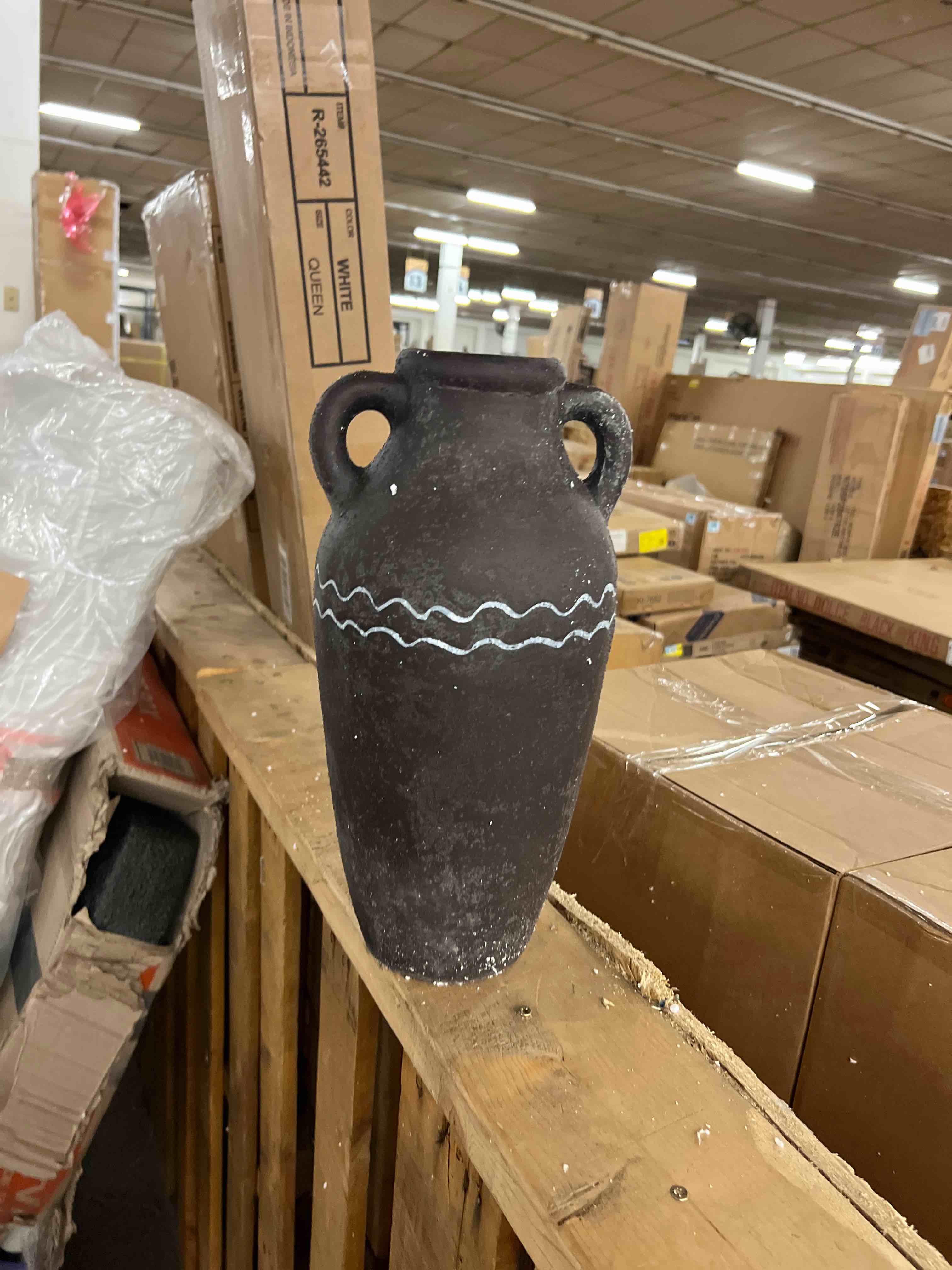 Condition photo showing New/Like New for large black ceramic vase 