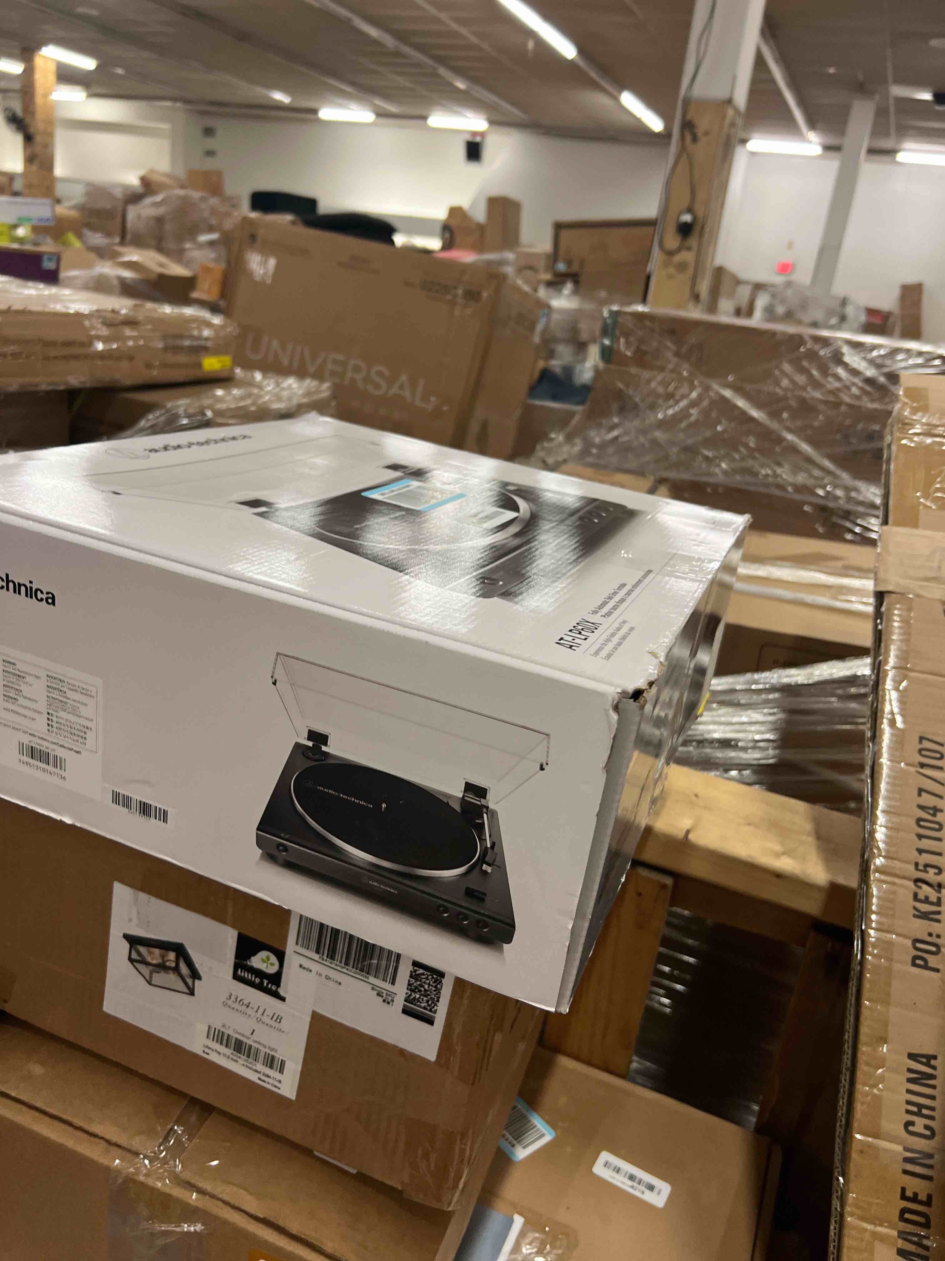 Condition photo showing New/Like New for audio-technica at-lp60x-bk fully automatic belt-drive stereo turntable, black, hi-fi, 2 speed, dust cover, anti-resonance, die-cast aluminum platter black wired turntable