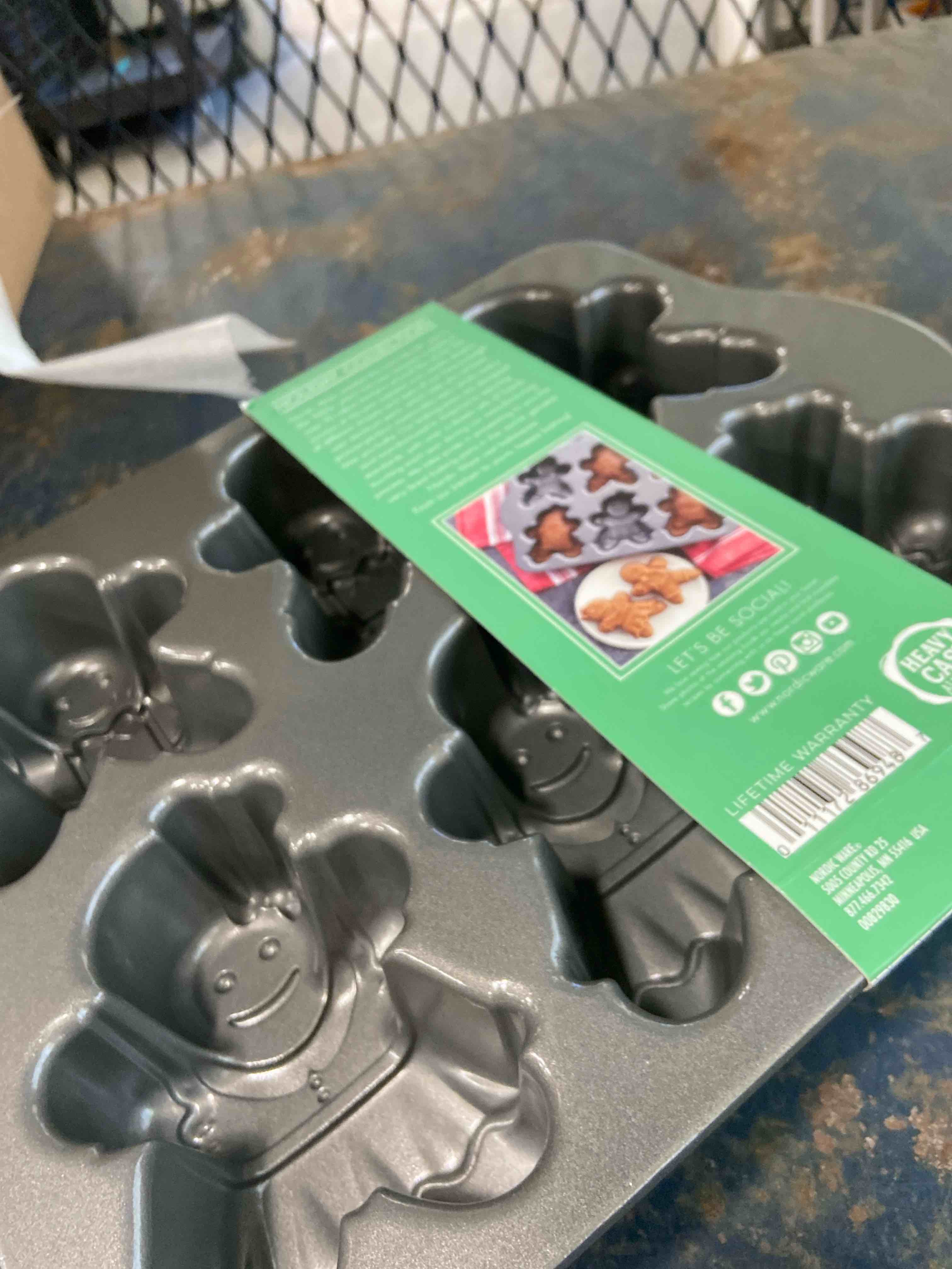 Condition photo showing New/Like New for nordic ware gingerbread kids cakelet pan