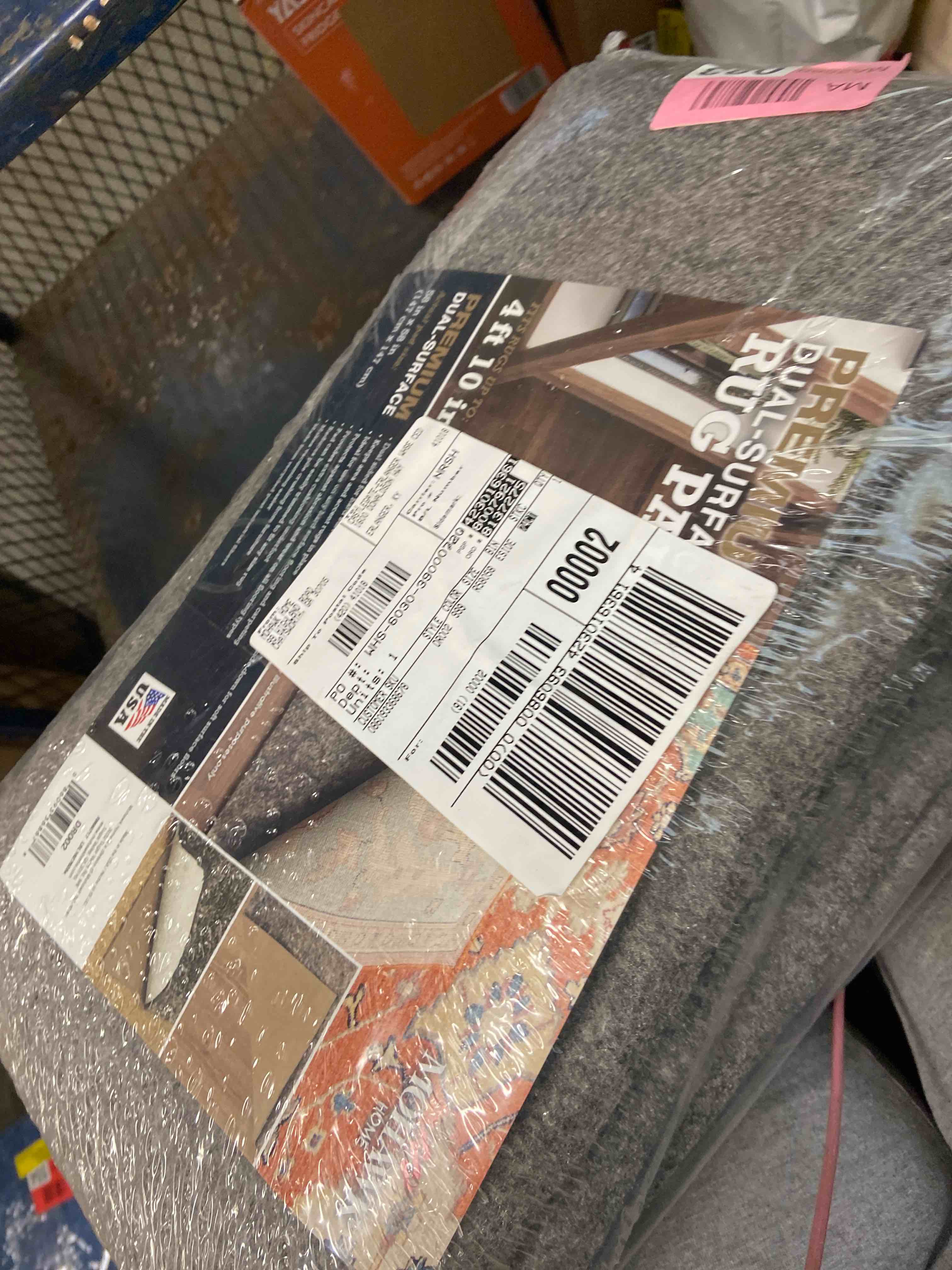 Condition photo showing New/Like New for mohawk 4'10" round premium dual surface rug pad brown: skid-resistant, polyester, latex backing, gray