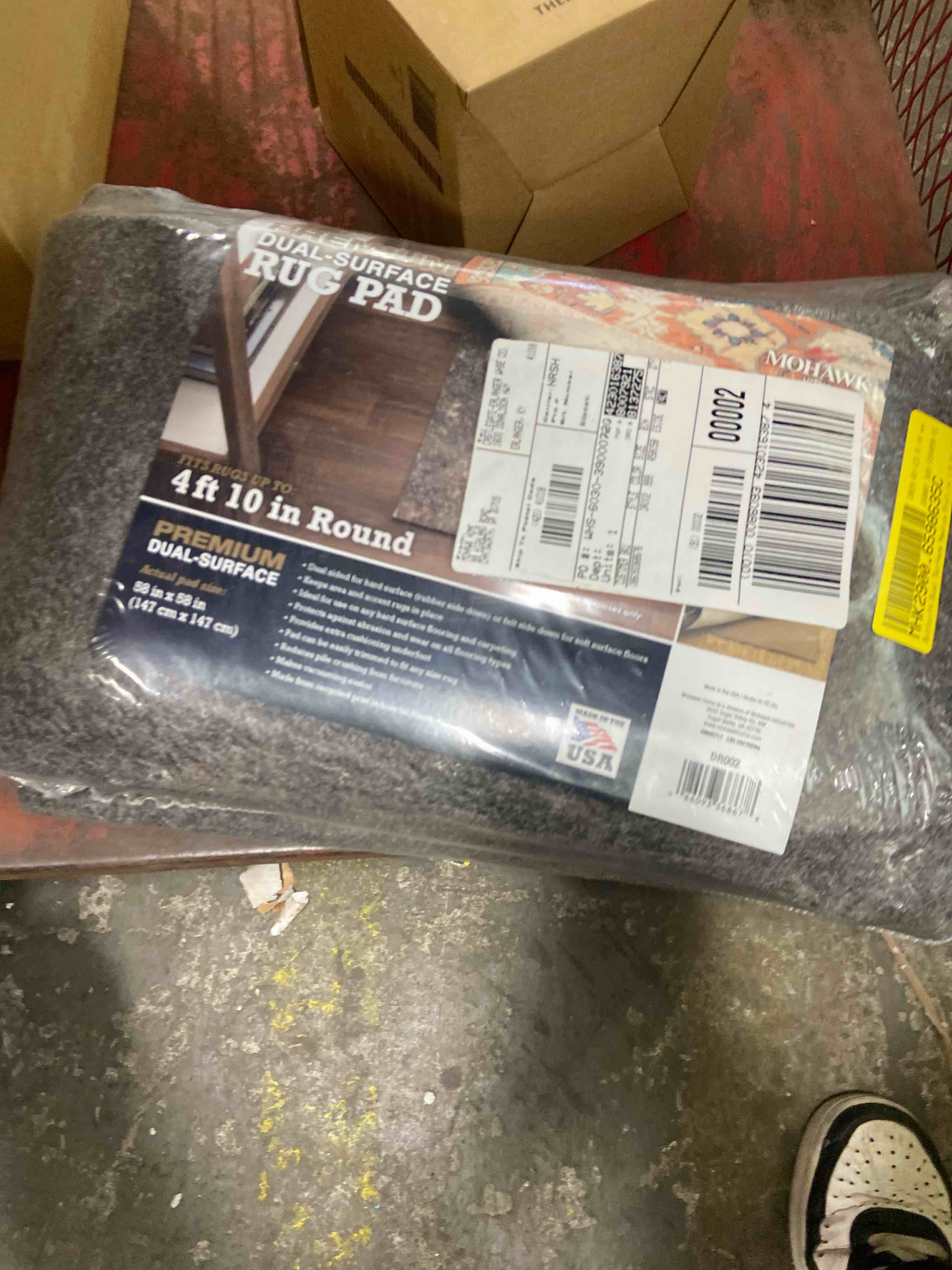 Condition photo showing New/Like New for mohawk 4'10" round premium dual surface rug pad brown: skid-resistant, polyester, latex backing, gray
