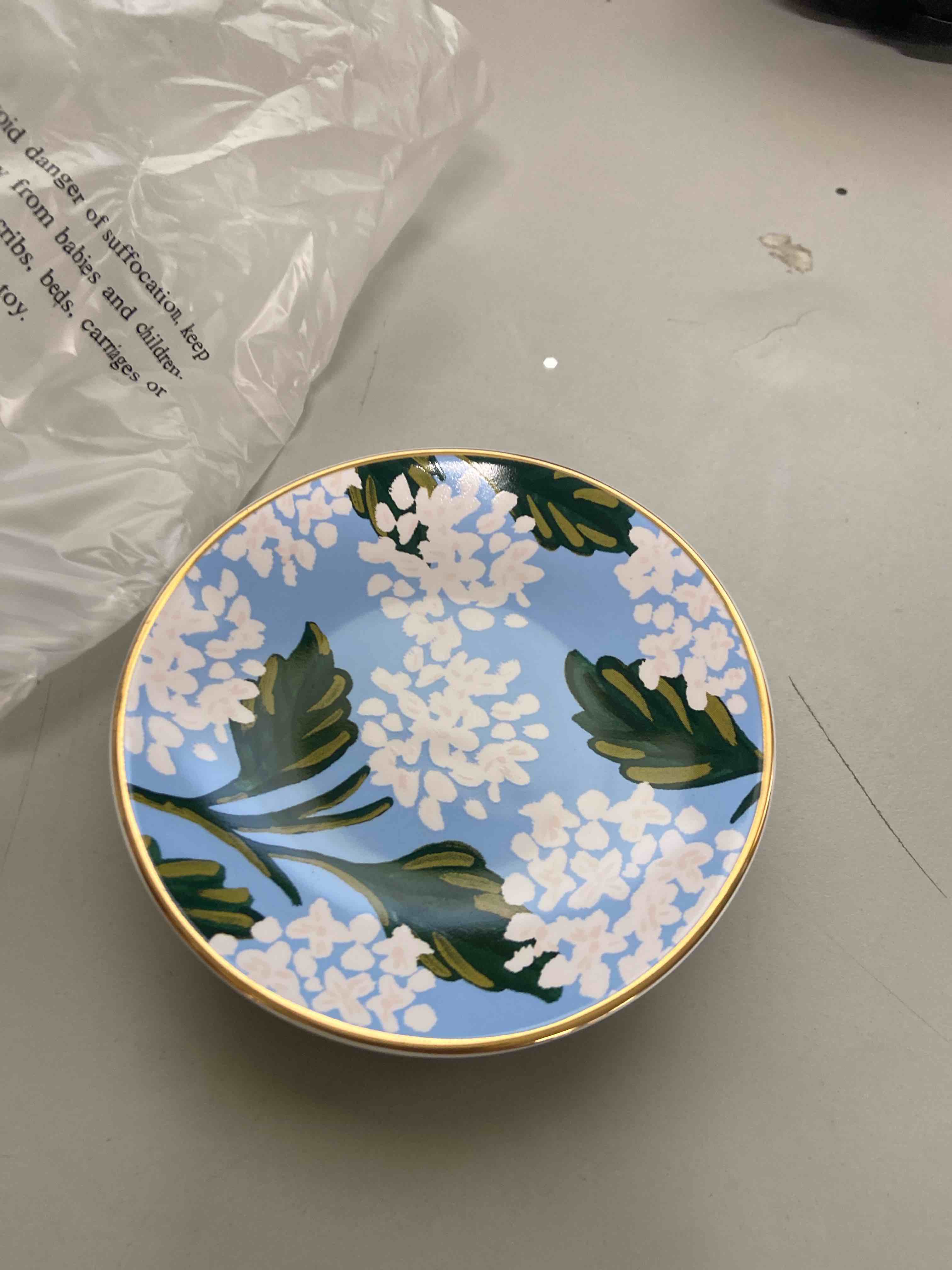 Condition photo showing New/Like New for rifle paper co. hydrangea ring dish, protect your trinkets and jewelry, minimize loss, organize desk, small item security, keep valuables safe and visible, cute and fashionable