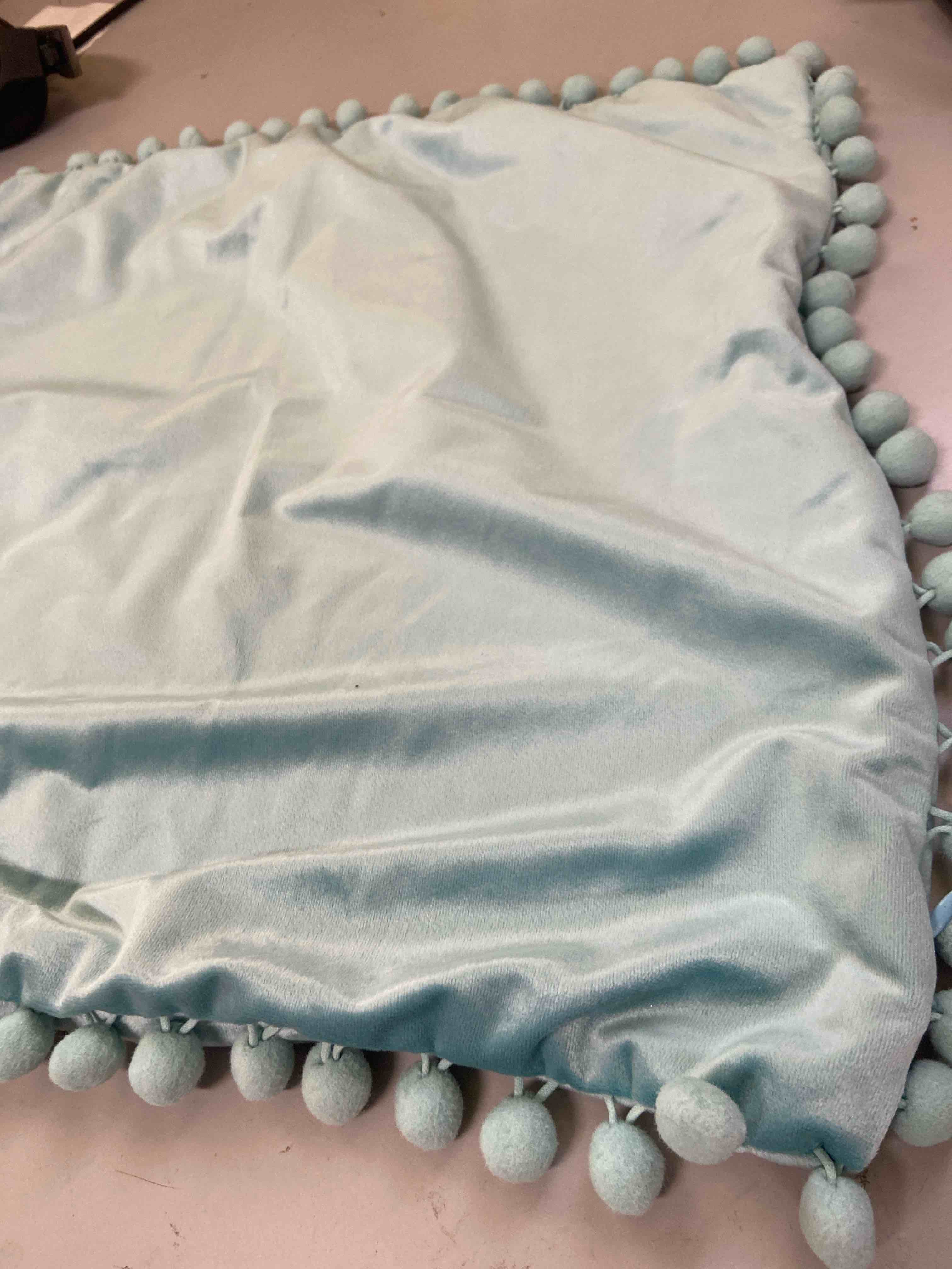 Condition photo showing New/Like New for pom pom pillow cover 