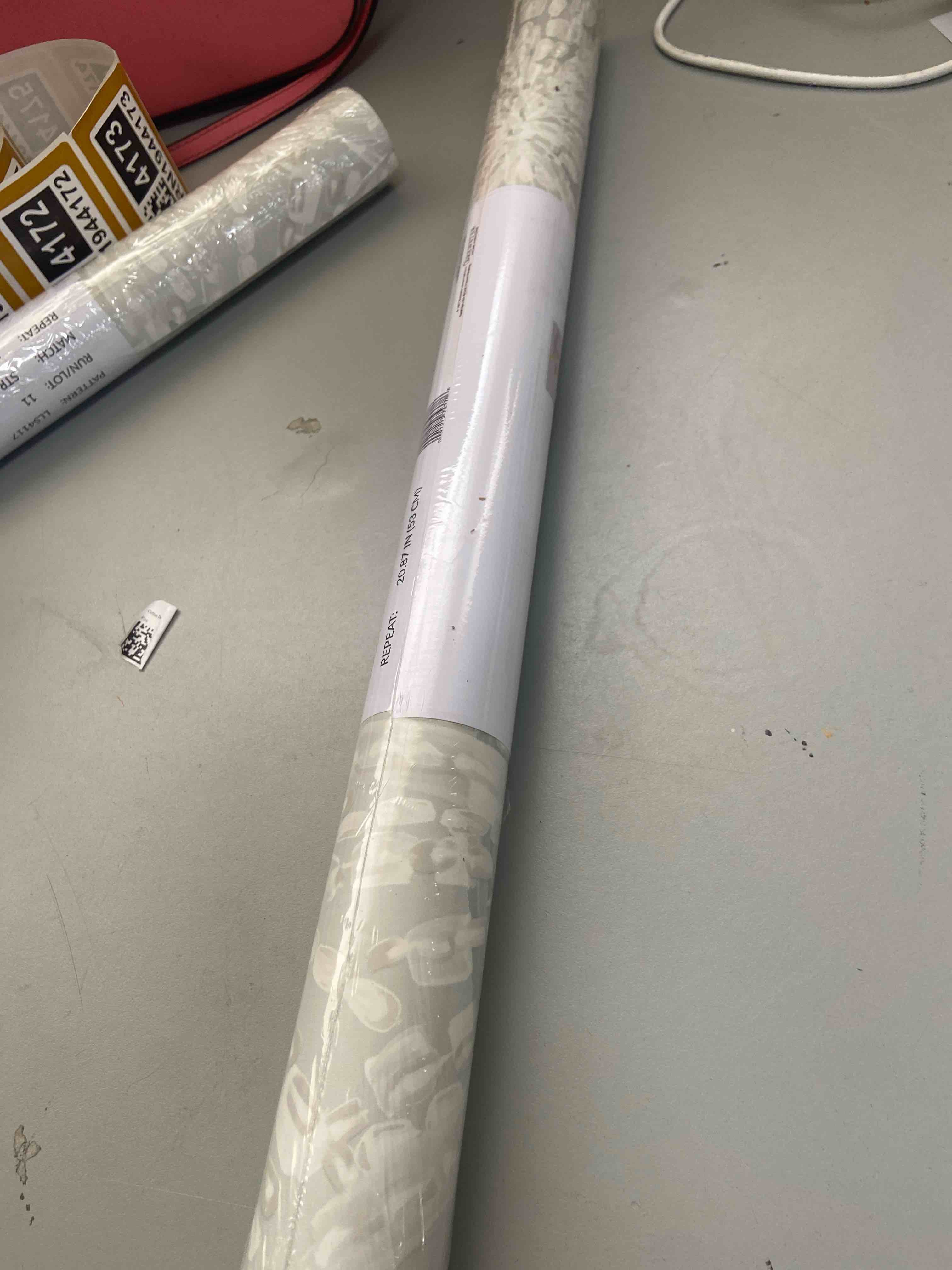 Condition photo showing New/Like New for lili whittwhitt silver sunburst peel & stick wallpaper