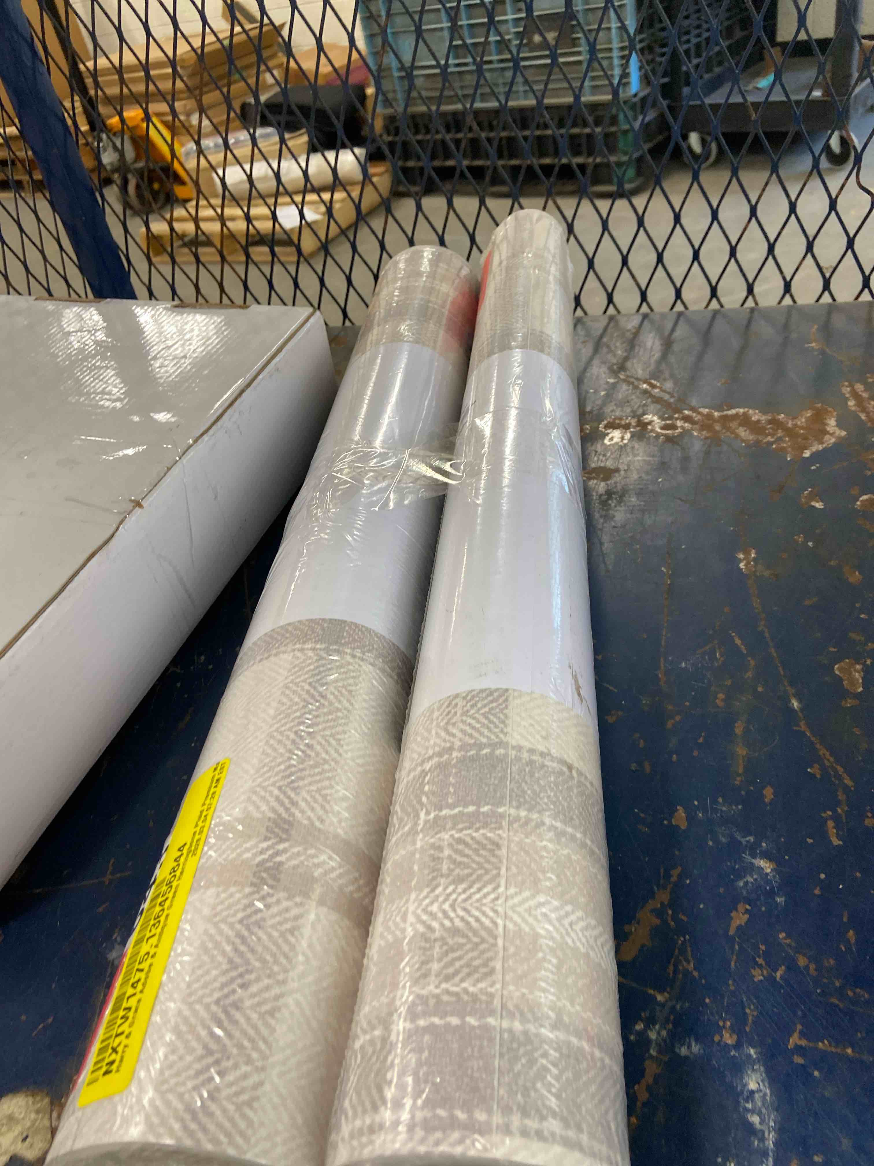 Condition photo showing New/Like New for 30.75 sq. ft. frosted calcutta herringbone plaid premium matte non-woven paper peel and stick wallpaper roll