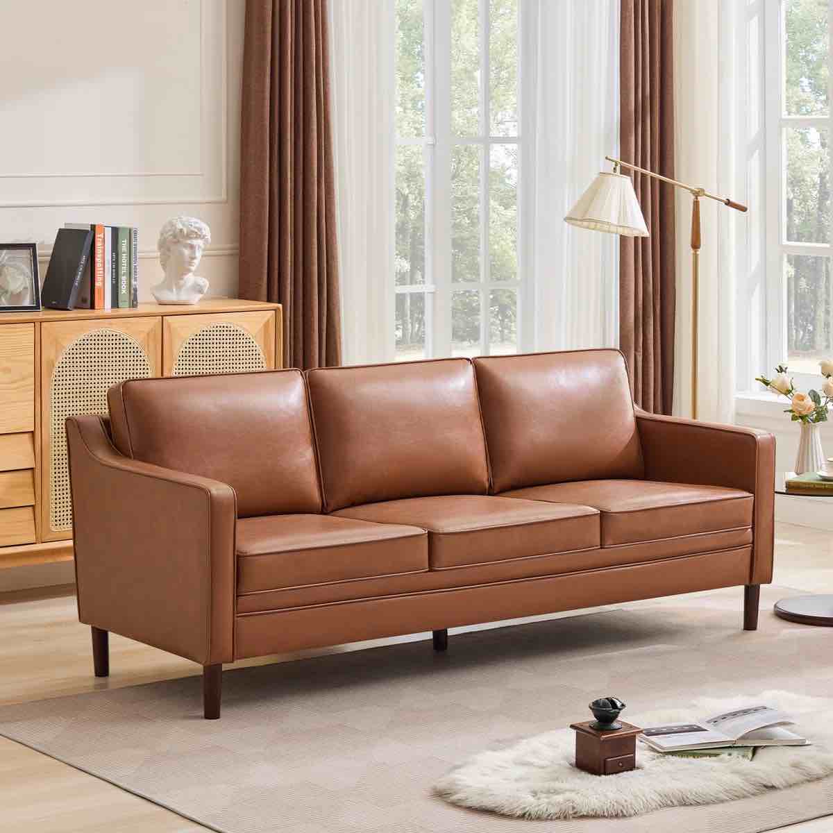 Azriah 80.31'' Camel Brown Vegan Leather Square Arm 3 Seater Sofa with Light Eucalyptus Wood Legs. 33.07'' H X 80.31'' W X 32.67'' D. Legs need replaced, can be purchased through Amazon or Walmart in variety of sizes for $10-25.