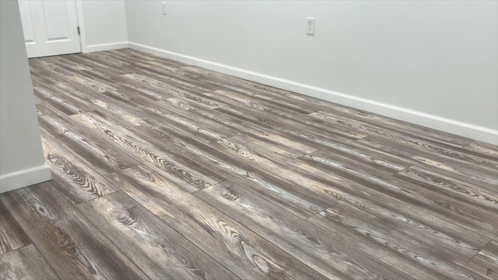Grey Ash Wood Grain Vinyl Sheet Flooring, 12’ x 5’. Will need power washed, minor tears on edge. 