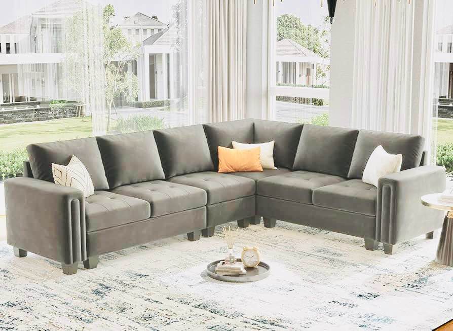 5 Piece 8 Seat Grey Velvet Modular L Shaped Sectional Sofa with Tufted Cushioning. Some marks on cushioning and sides, otherwise beautiful condition. 108” W x 32” D x 28” H 