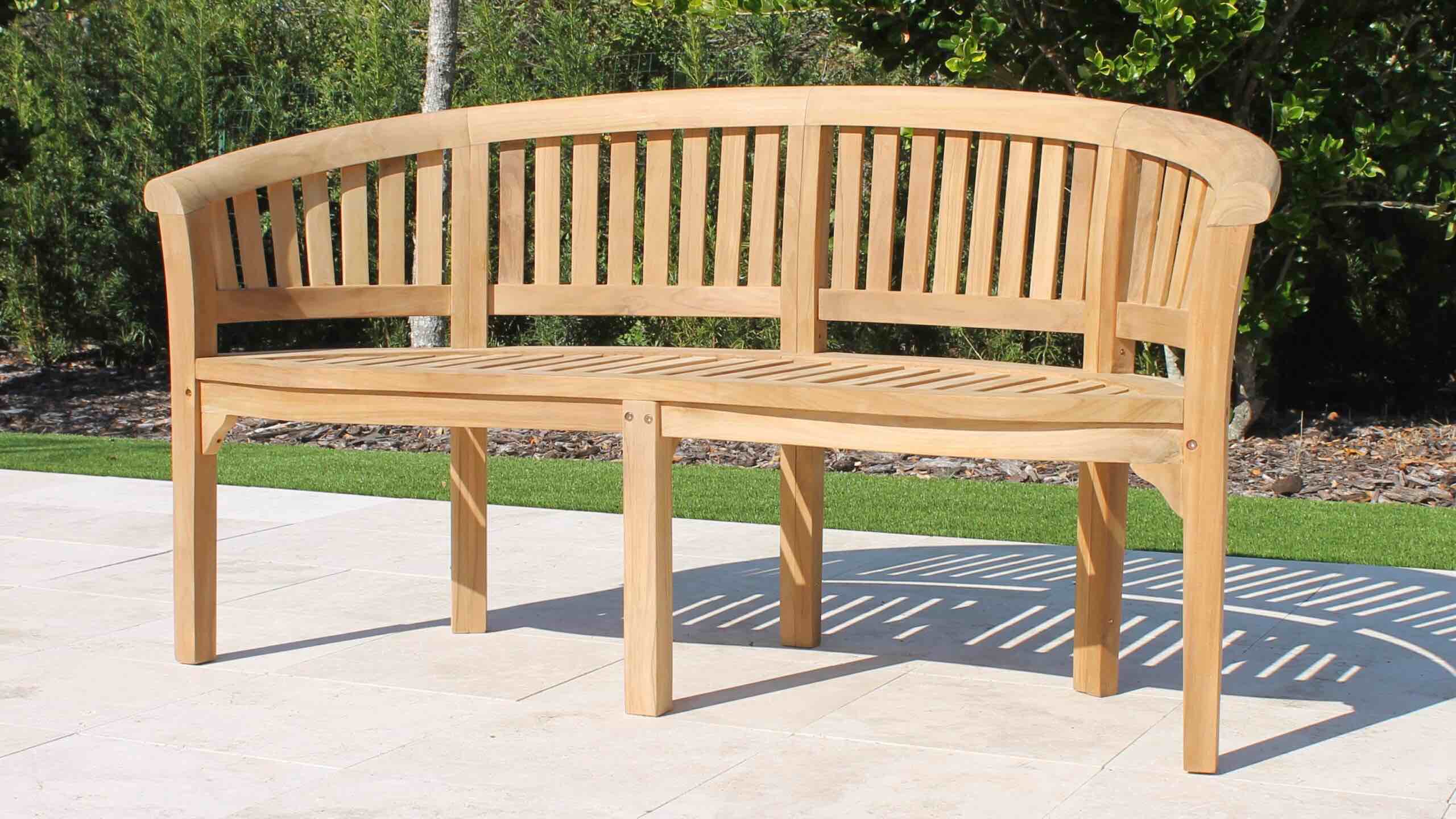 Natural Teak Wood 64in Deluxe Banana Curved Bench. Left arm can be refurbished with Several pieces of Teak Wood and Wood Glue. Length 64in x 33.5in Height x 22in Depth