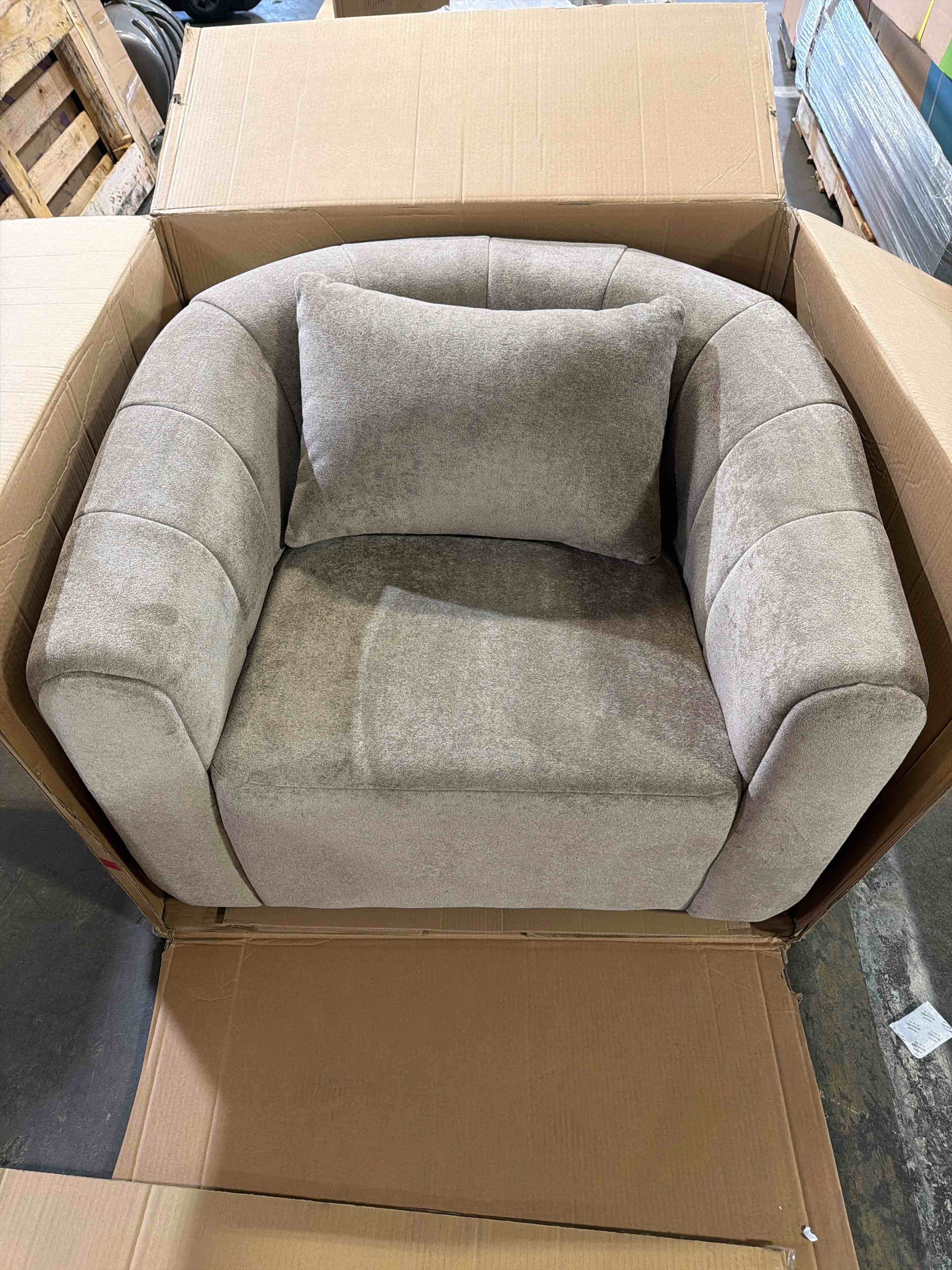 Condition photo showing New/Like New for 37” wide velvet upholstered tan swivel barrel chair with an accent pillow, channel tufting design, overall dimensions 27.95'' h x 37'' w x 31.5'' d, stock photos are not exact color, see product photos listed