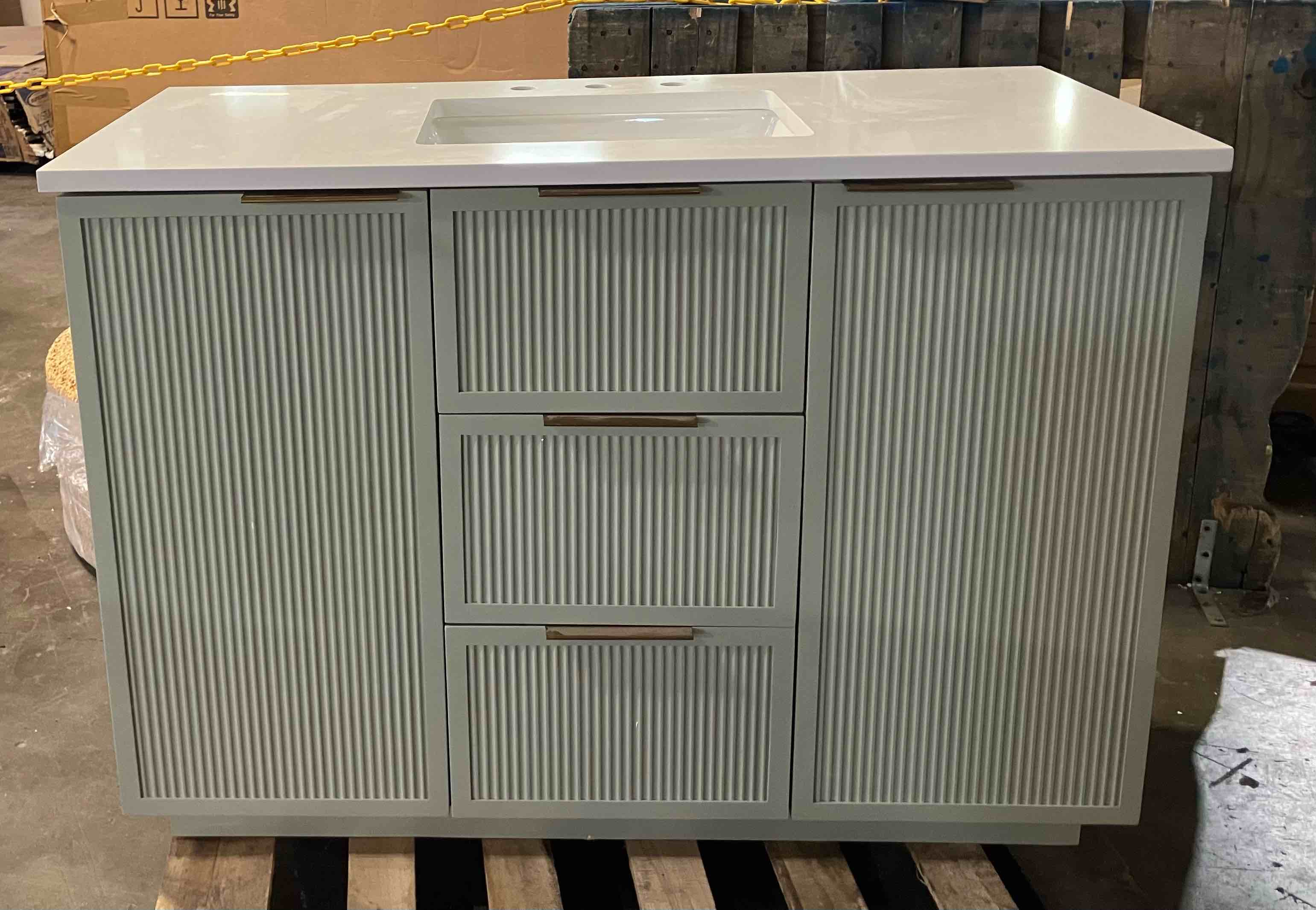 Condition photo showing New/Like New for addison 48? light sage vanity with ariston white top - item is new/like new, but it is noted that there are small scuffs on the left side, as well as a very small chip on the back left side of top, both pictured)