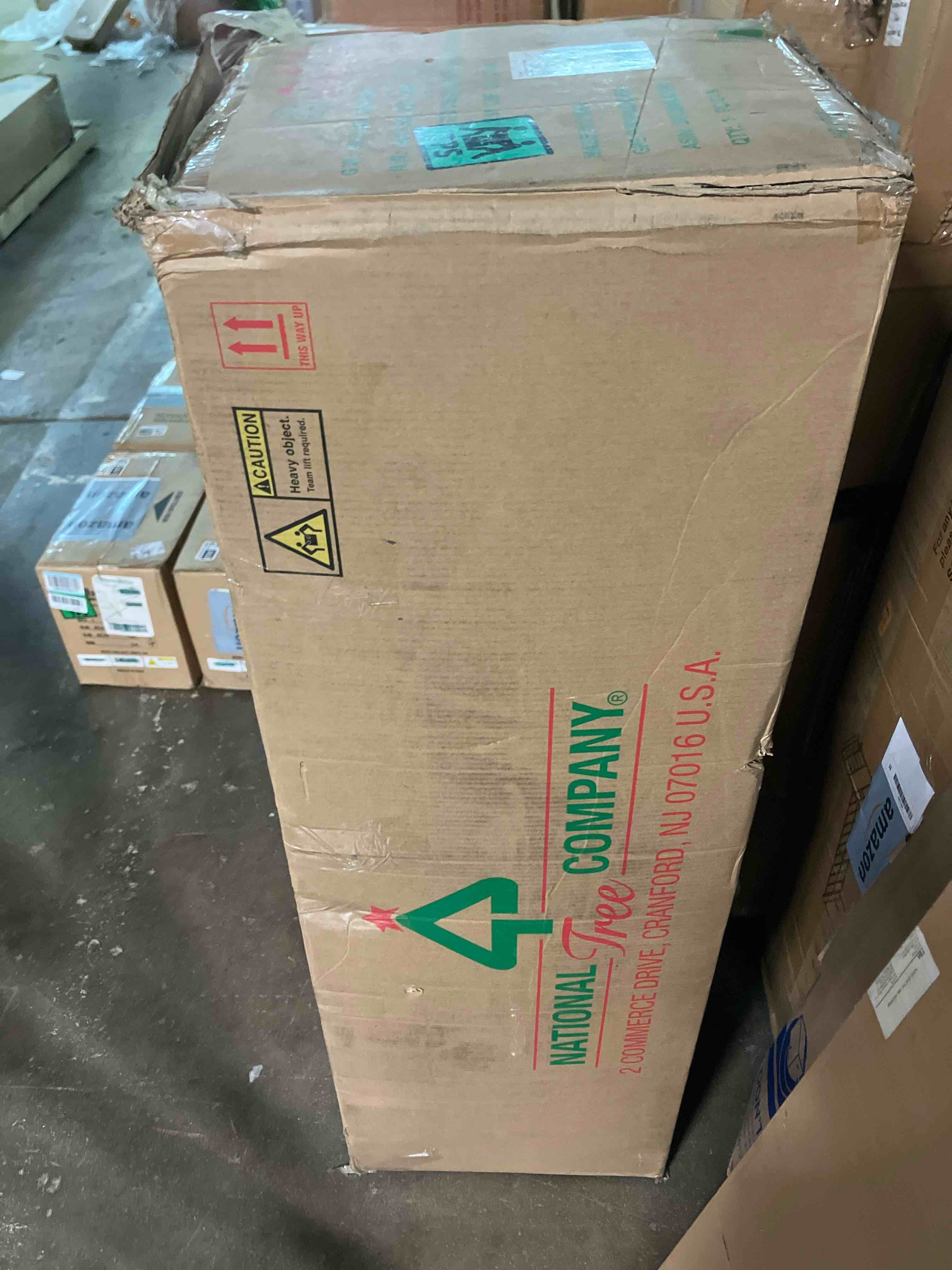 Condition photo showing New/Like New for National Tree Company 6.5 ft Pre-Lit Downswept Douglas Fir Slim Artificial Christmas Tree, 300 LED Lights, 640 Tips, PowerConnect, Foot Pedal, 10 Light Functions, Includes Stand, Green