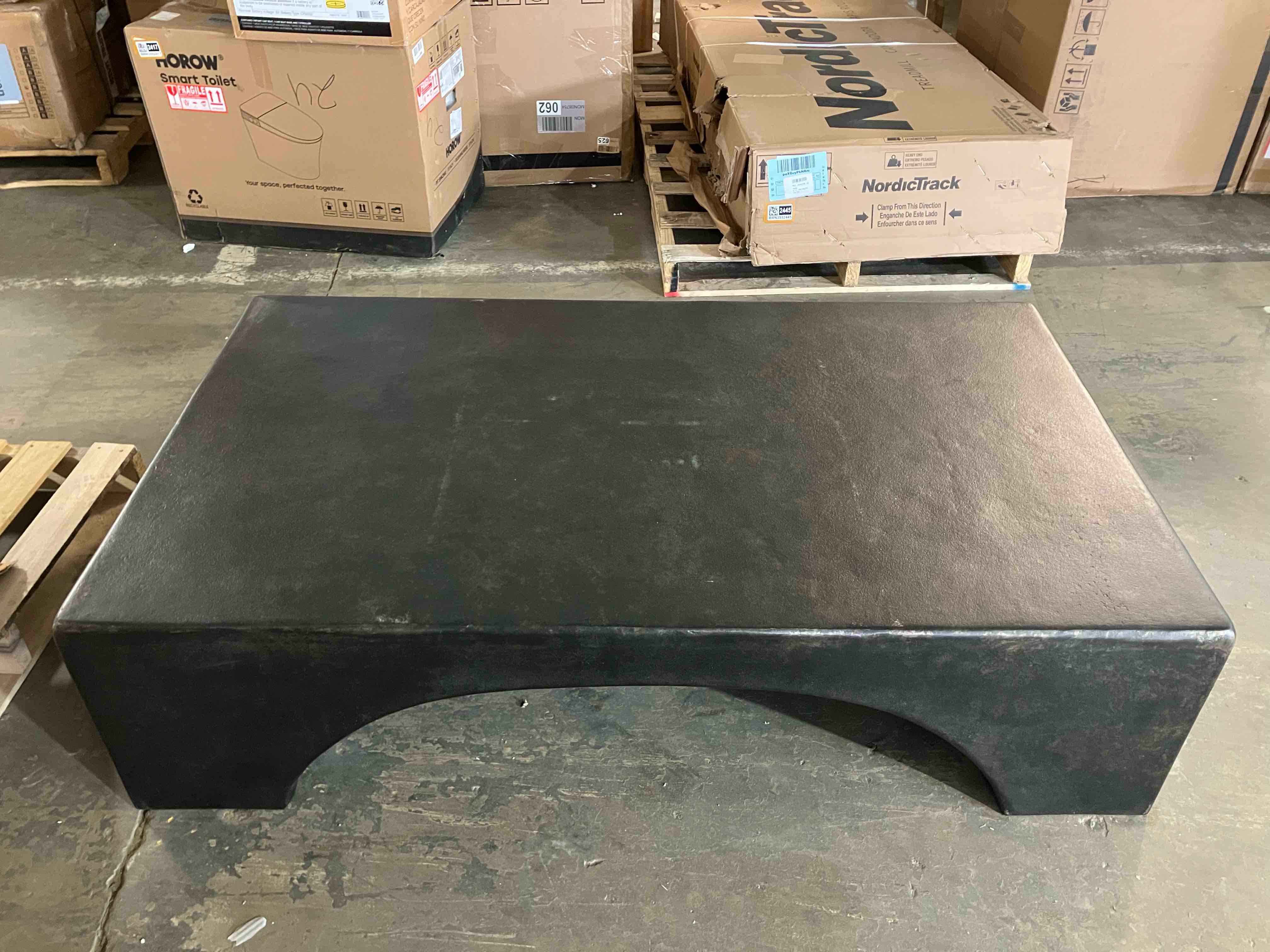 Condition photo showing New/Like New for Palumbo Outdoor Coffee Table by Four Hands in Worn Distressed Bronze Color - (This coffee table is meant to look worn and distressed in places, all stock photos online show random sections of intentional wear. Item is new/like new)