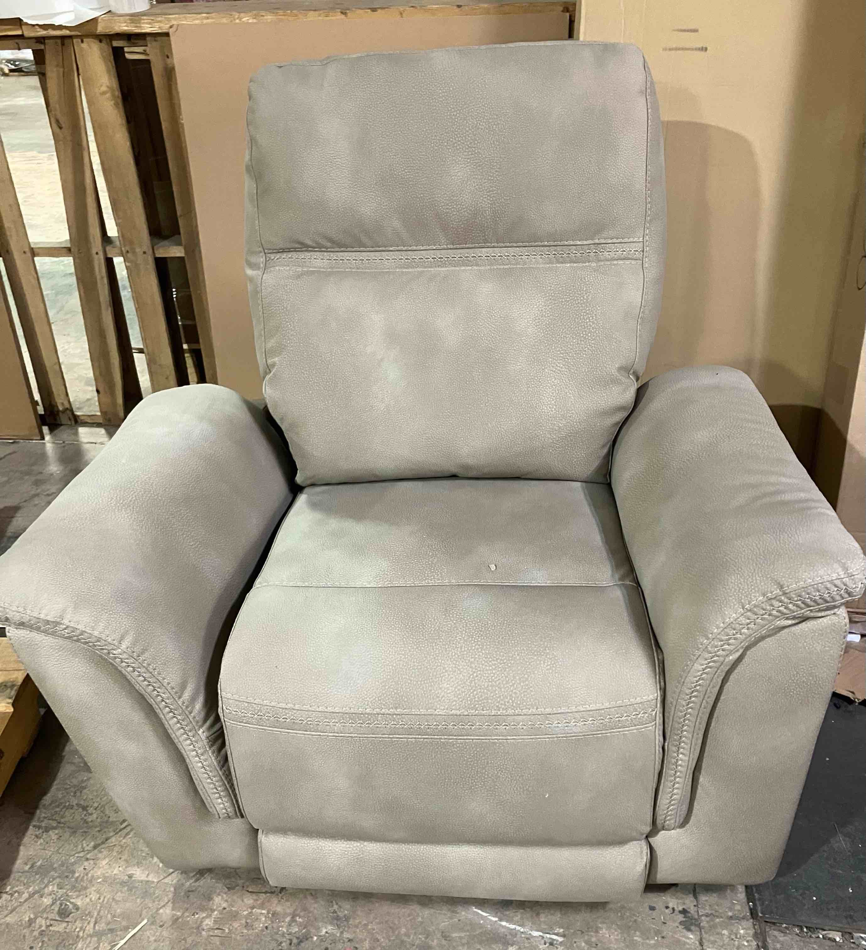 Condition photo showing As Is for Signature Design by Ashley Next-Gen DuraPella Power Recliner with Adjustable Headrest, Beige - (As is because there is damage to the left side of the chair, pictured, that will need repaired)