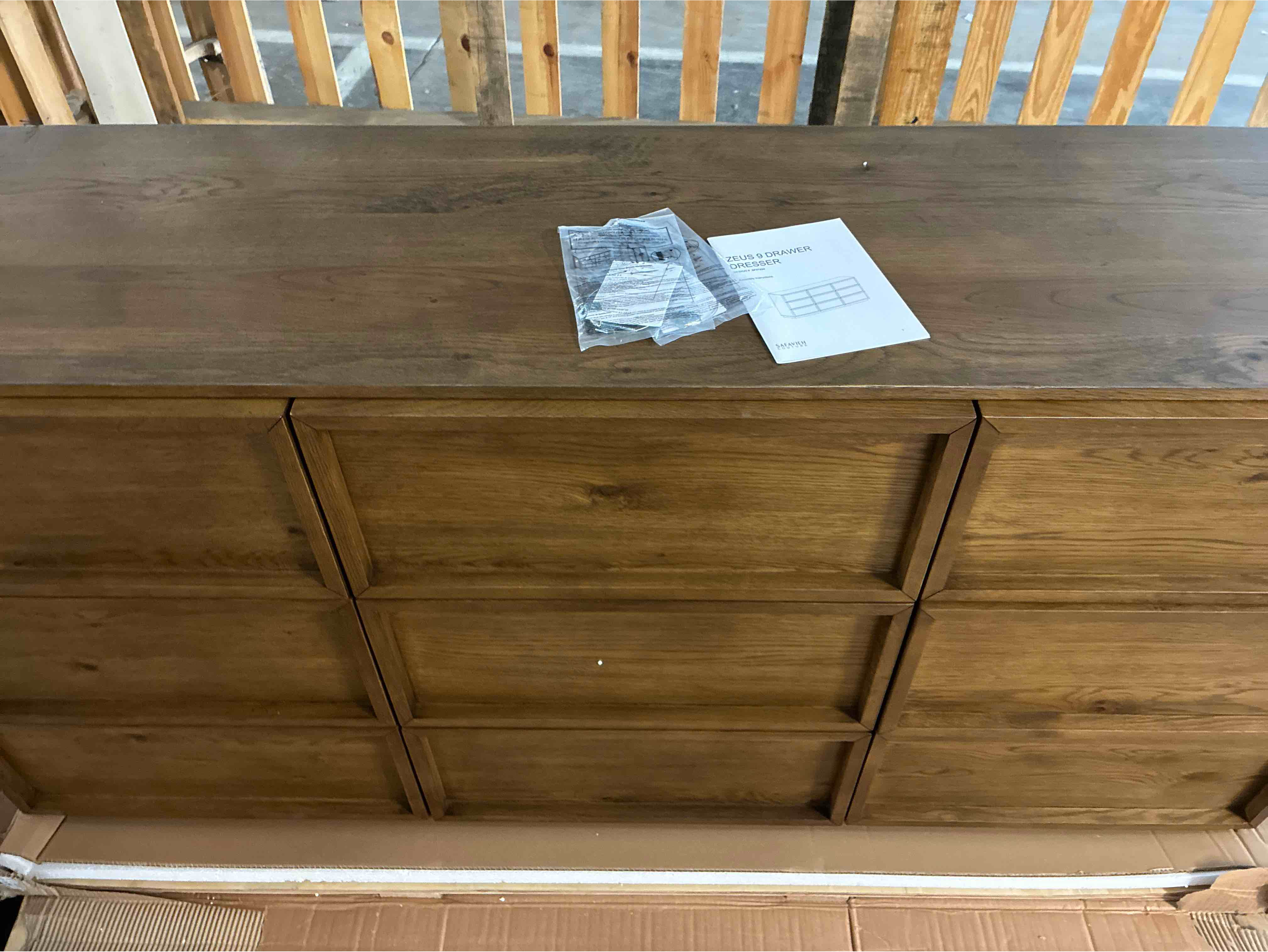 Condition photo showing New/Like New for Hudson 9-Drawer Acacia Wood Dresser in Medium Brown with Inlet Handles and Linen Lined Drawers. 35'' H X 72'' W X 20'' D
