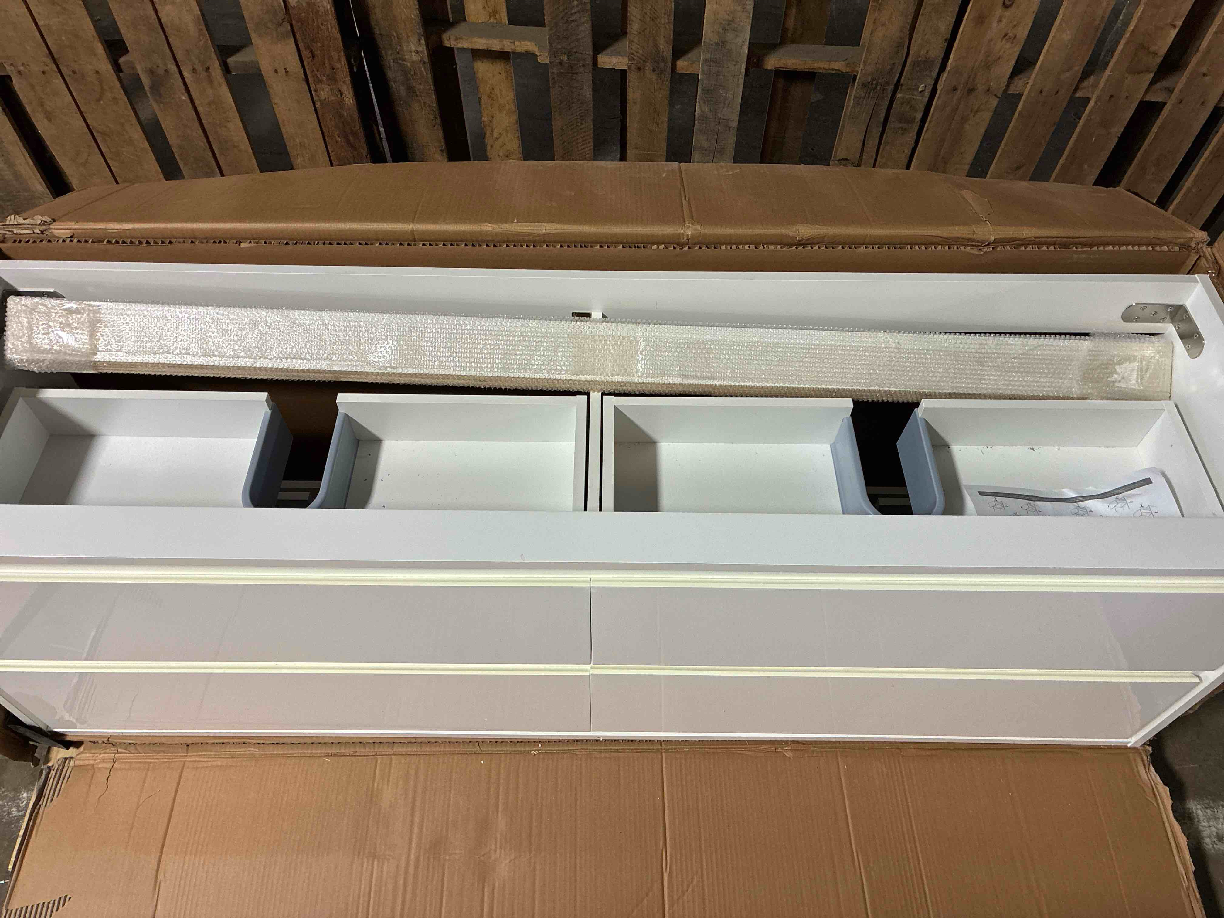 Condition photo showing Good Condition for Abruzzo Wall Mounted Acrylic Double Sink Bathroom Vanity with 4 Drawers. Sink top sold separately, cosmetic chip on inner left top drawer, does not affect functionality, left top drawer needs rehinged to open smoother, otherwise beautiful condition. 71” L x 19” D x 23” H 