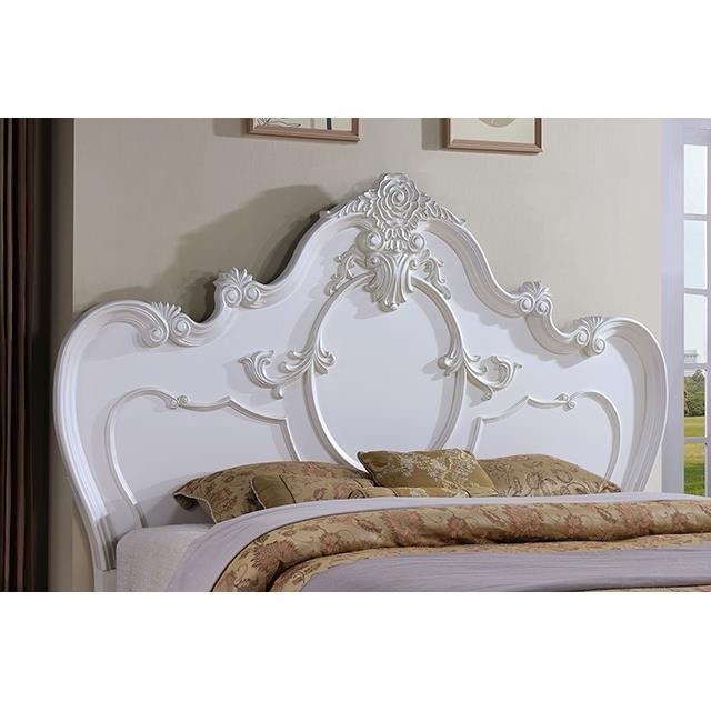 Condition photo showing As Is for Roselli Eastern King Size Distressed White Hand Carved Bed Frame with Antique Accents, 2 thin scratches along top of footboard, chip along right side of headboard. Slats need replaced, can be purchased through Amazon