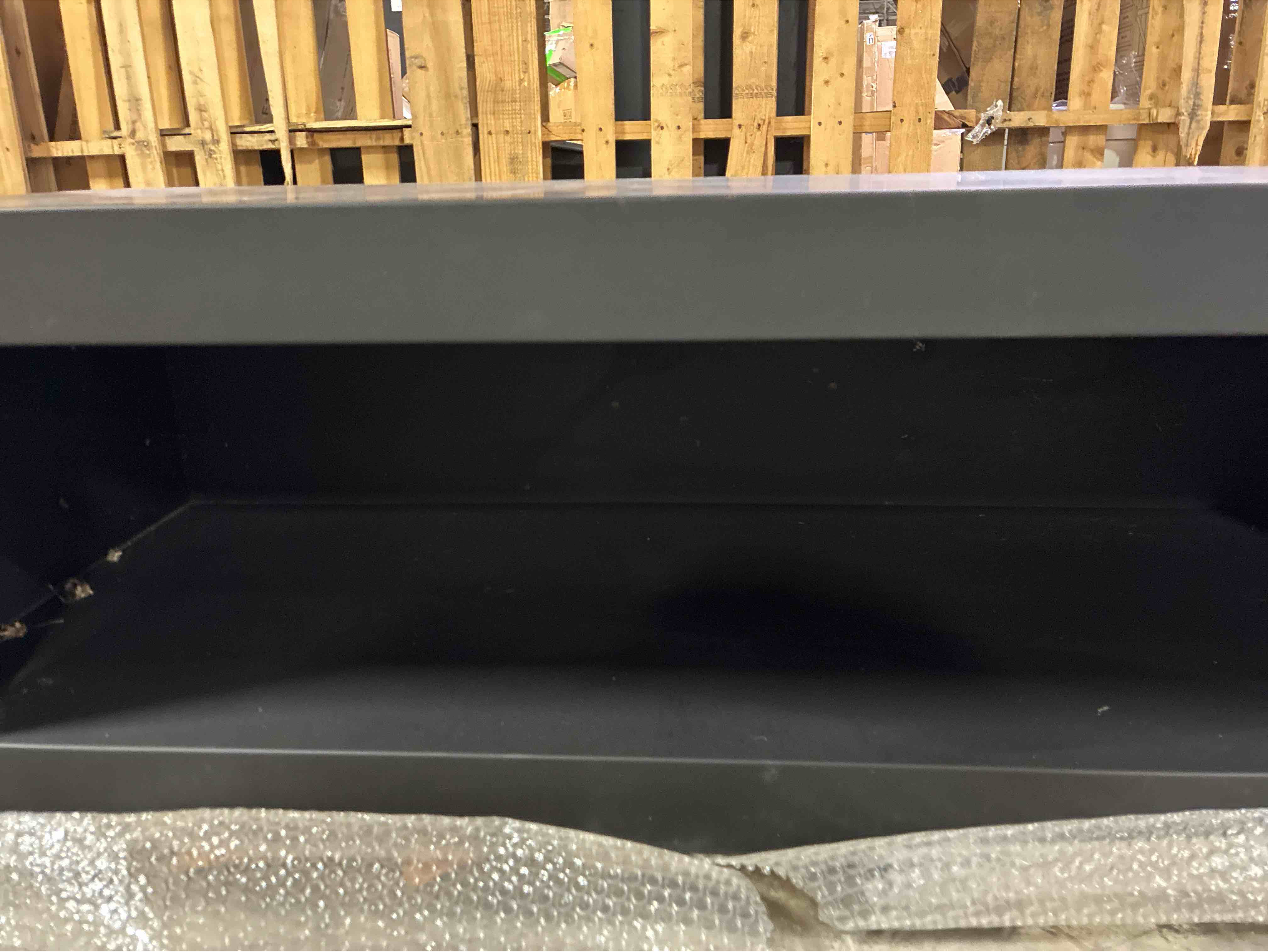 Condition photo showing Good Condition for Black Iron 47” Fully Enclosed Modern Wood Log Holderfor Fireplace. Minor scuffs on interior otherwise beautiful condition. 47” L x 18” D x 16” H