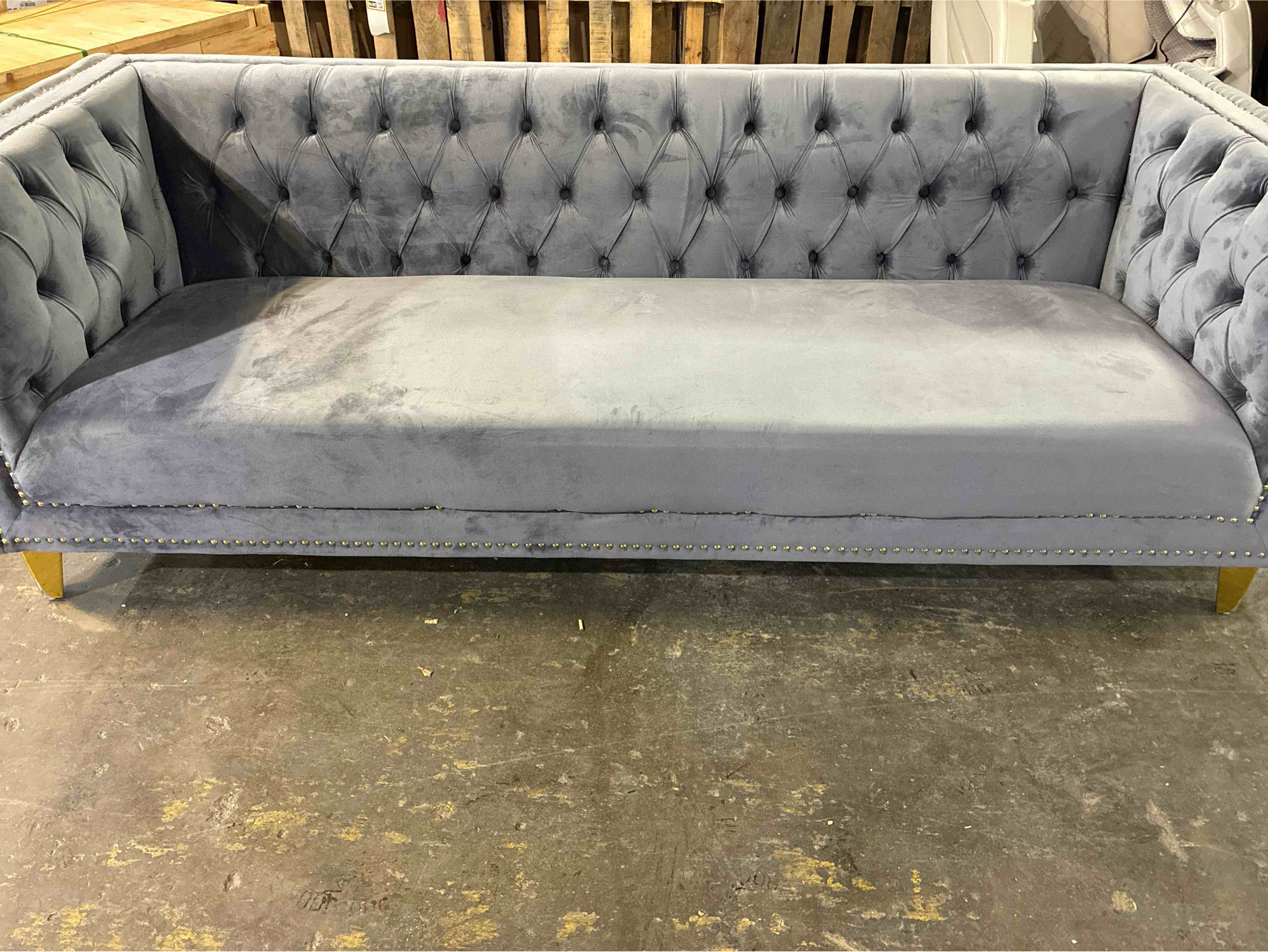 Condition photo showing Good Condition for Sickels 90" Gold Button Upholstered Light Grey Velvet Tuxedo Arm Sofa with Tufted Back, & Gold Metal Legs. Minor scuffing on edges of front feet, can be recoated. 30'' H X 90'' W X 34'' D