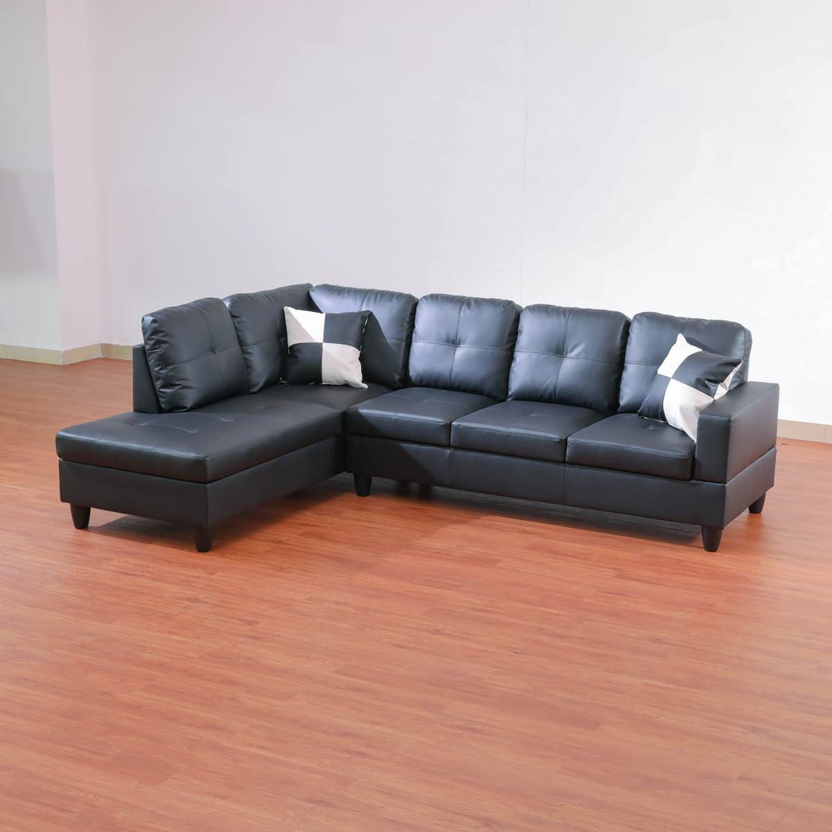 Condition photo showing New/Like New for Mavretta Vegan Leather Sectional and Matching Toss Pillows, 35'' H X 103.5'' W X 74.5'' D