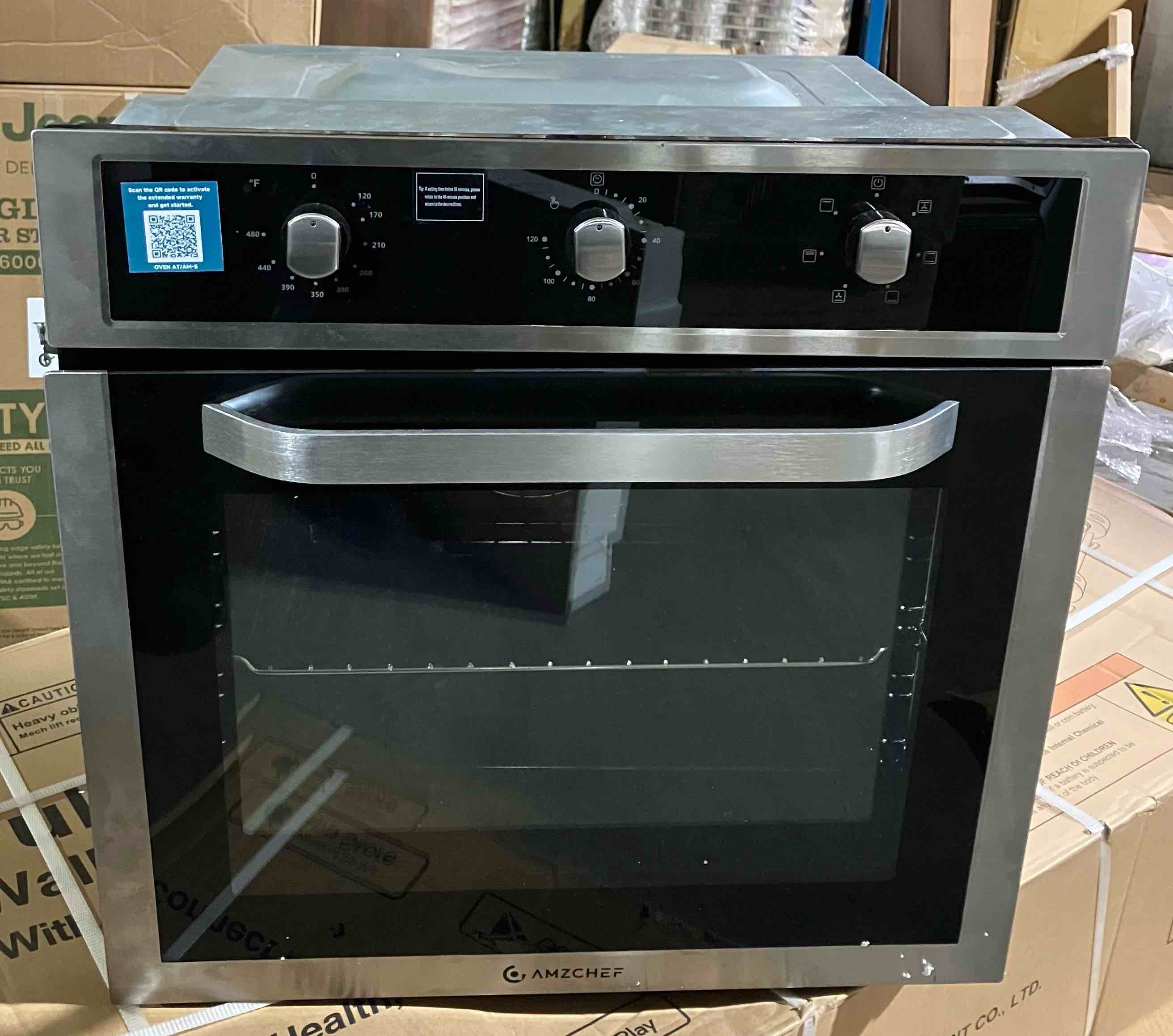 Condition photo showing Good Condition for 24 in. Single Commercial Electric Wall Oven With Convection in. Stainless Steel - (Good condition because oven door is slightly crooked, pictured, and oven has a few dents on the top and sides that are not visible when mounted)