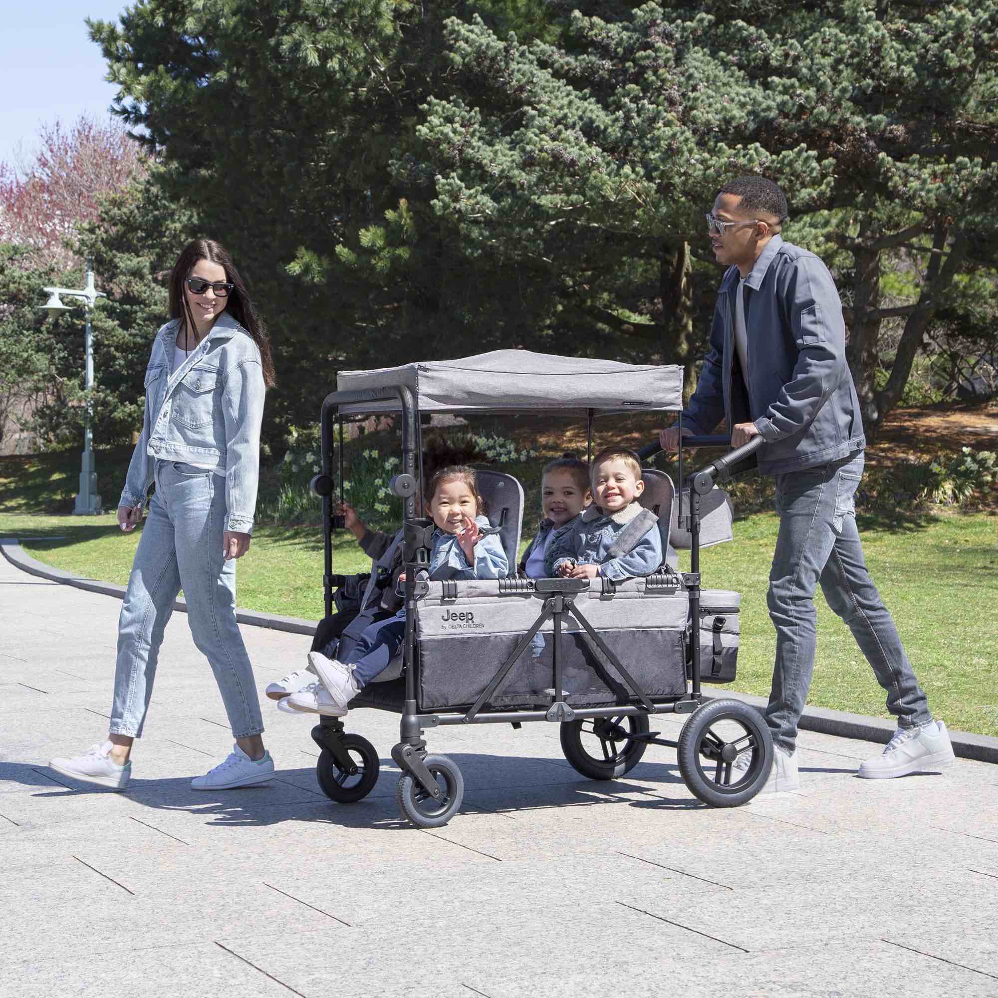 Condition photo showing New/Like New for Jeep Wrangler Deluxe 4 Seater Stroller Wagon by Delta Children - Premium Quad Stroller Wagon for 4 Kids with Convertible Seats, Adjustable Push/Pull Handles, Removable Canopy & Flat Fold, Grey