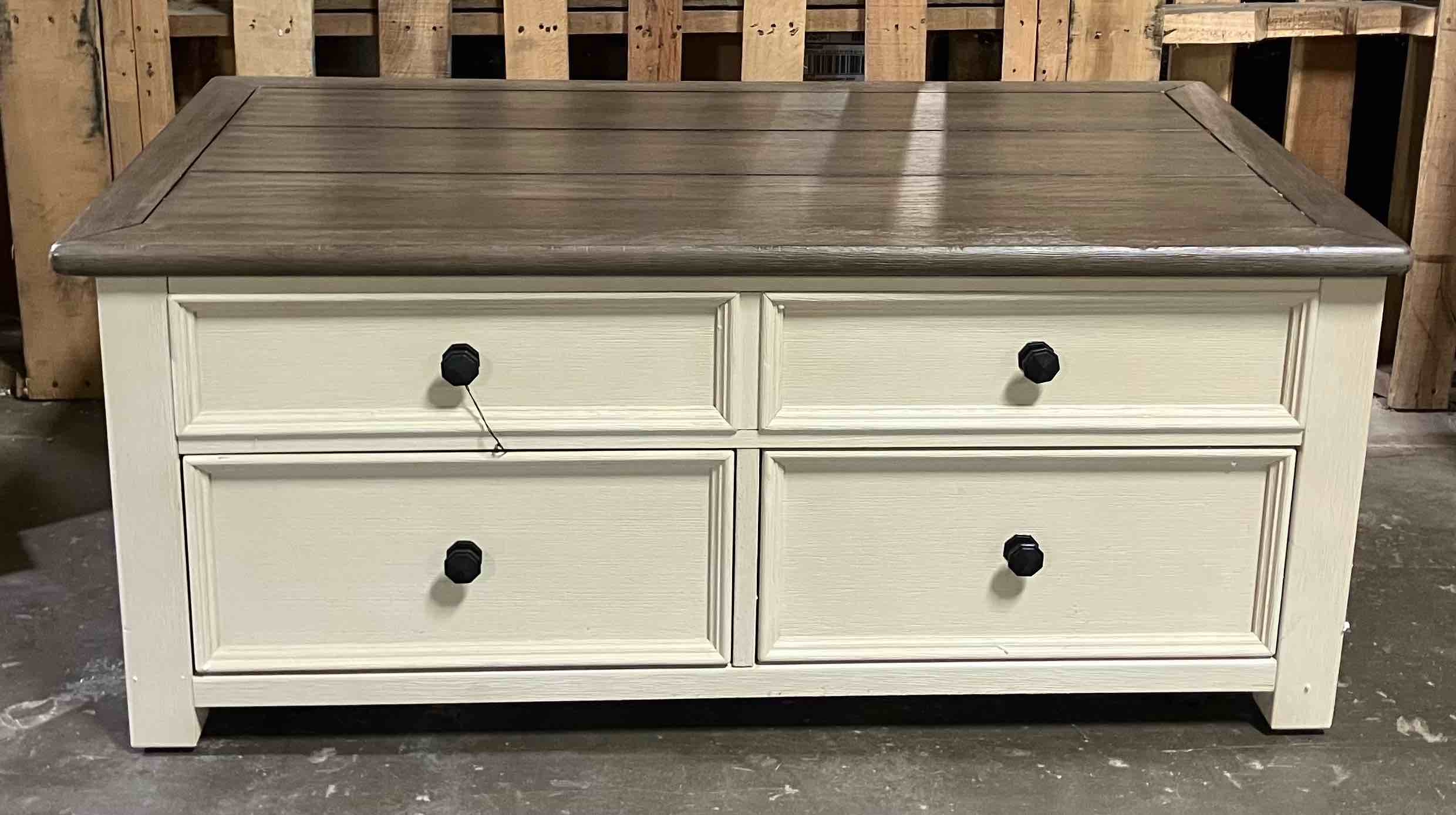 Condition photo showing Good Condition for Bolanburg Coffee Table with Lift Top- (Good condition because of a few small nicks/chips in wood in a couple places)