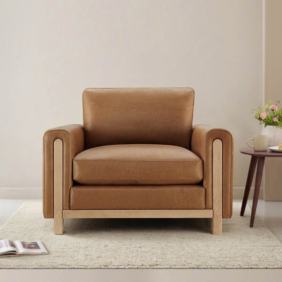 Condition photo showing Good Condition for adika genuine leather club chair with a natural ash solid wood frame and removable cushions, overall dimensions 34.3'' h x 42.5'' w x 39.8'' d, frame of chair has some scuffs on wood frame(pictured), leather of the chair has some slight blemishes and scratches(pictured) 